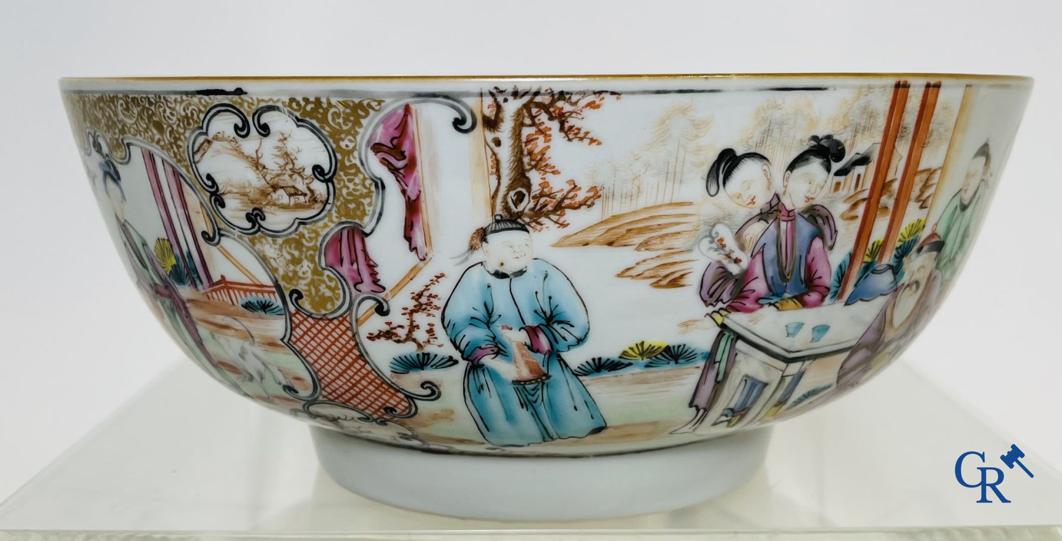 A large Chinese famille rose mandarin bowl, a famille rose cup and saucer and a figurine in blanc de chine.