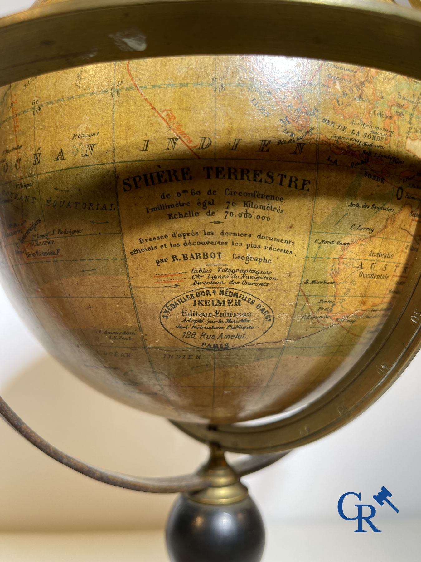 An antique globe with meridian circle on a black lacquered wooden base. 19th century.