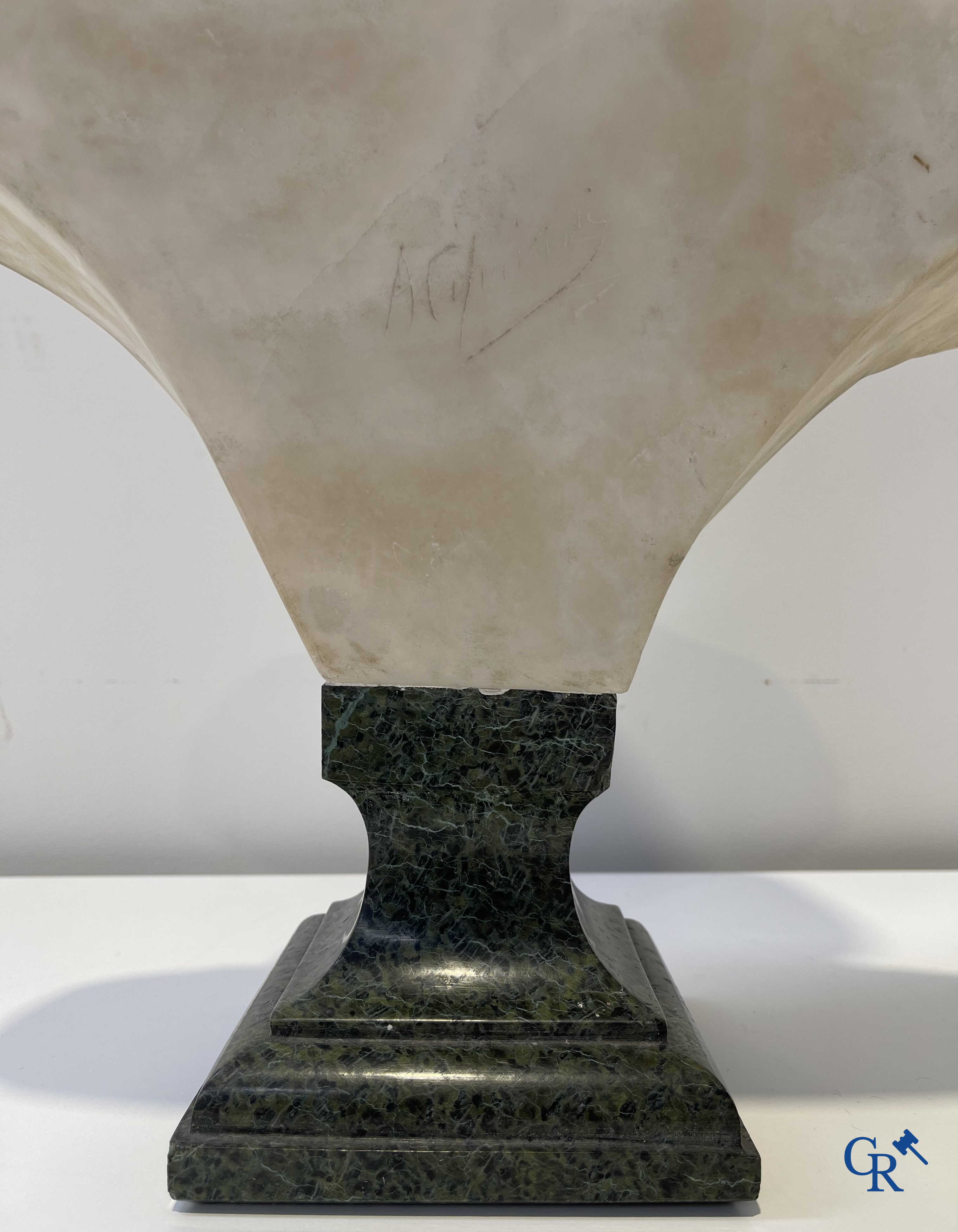 A. Cipriani. An imposing bust in marble on a green veined marble pedestal. Art Deco period.