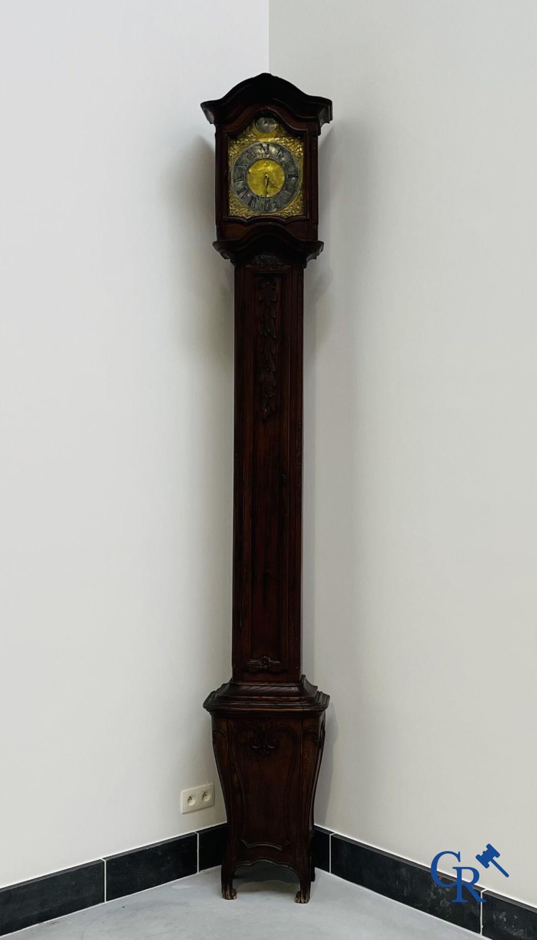 Standing clock in oak. 18th century.