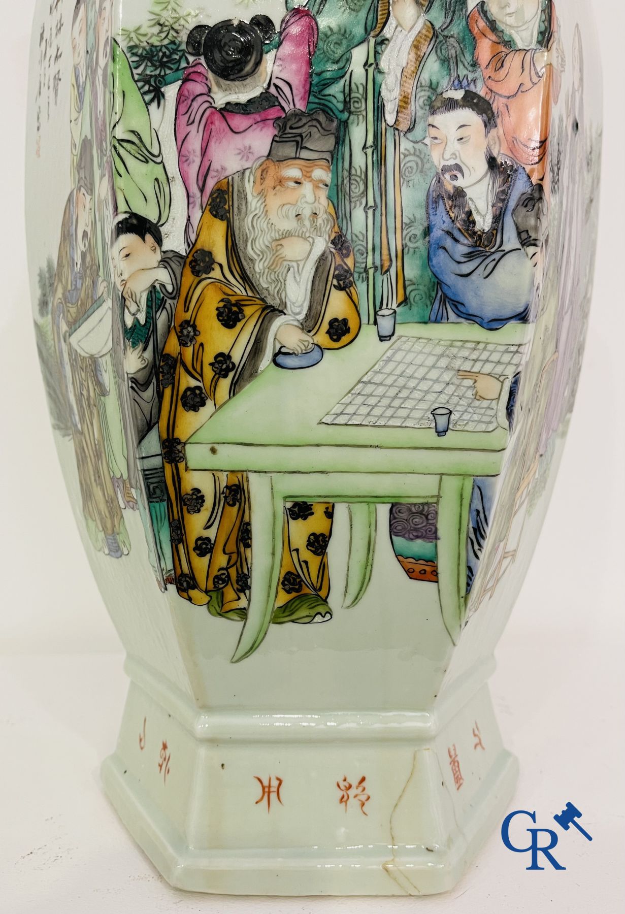 Asian Art: Chinese porcelain. A hexagonal Chinese Famille rose vase with sages and scholars. 19/20th century.