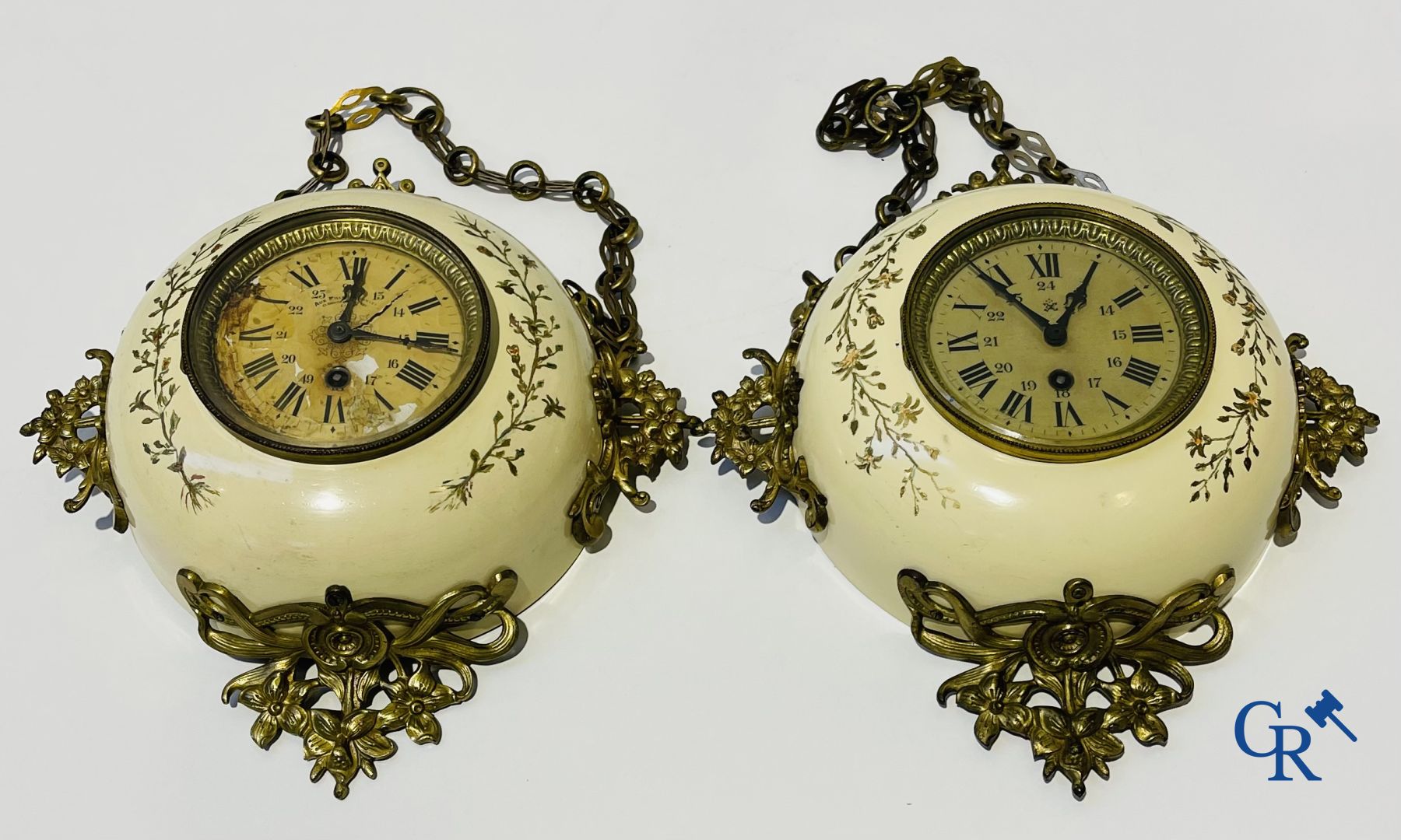 A three-part bronze fireplace clockset in Renaissance style and 2 painted tin and bronze pendant clocks.