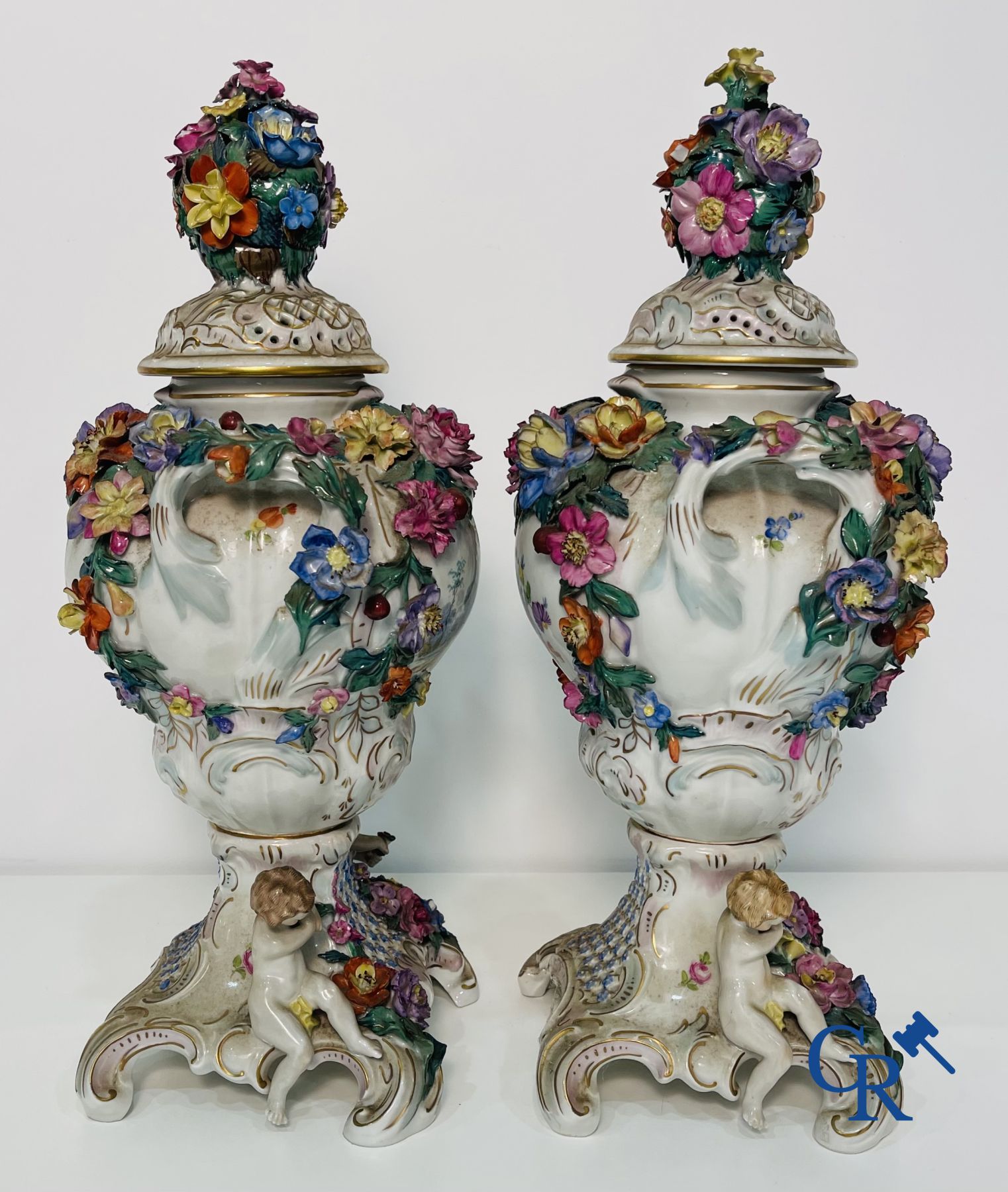 Dresden: A pair of openwork porcelain lid vases.