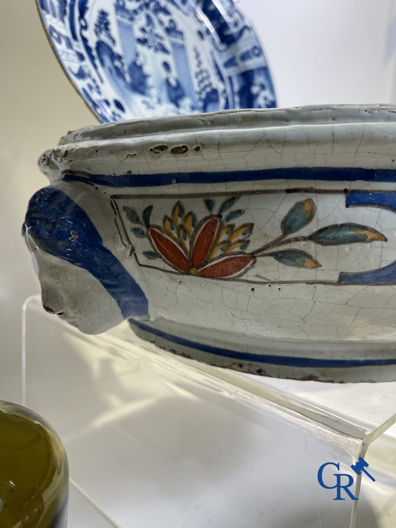 A part of a North French fountain and various pieces in faience and various antiques.