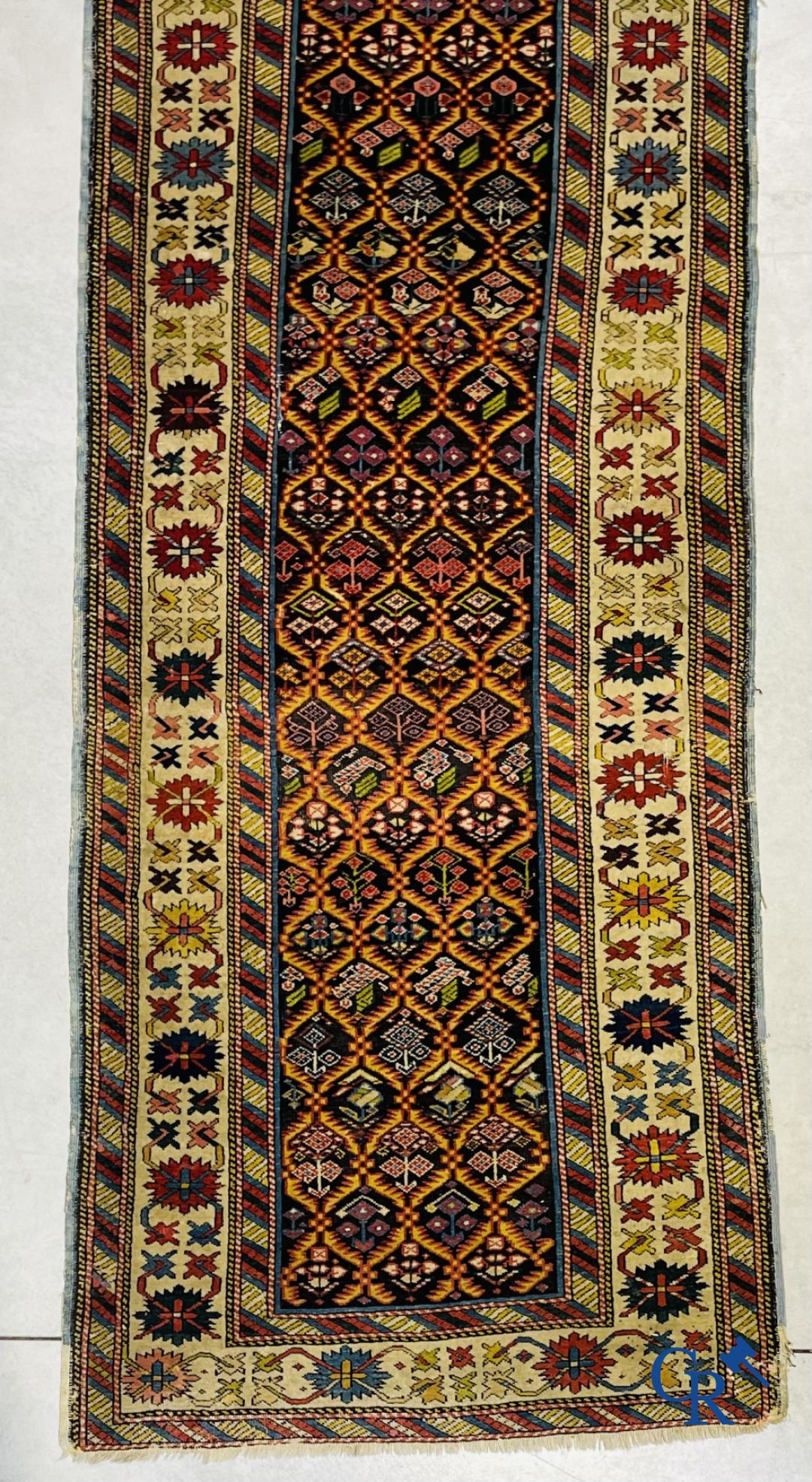 Tapis: Un ancien tapis oriental.