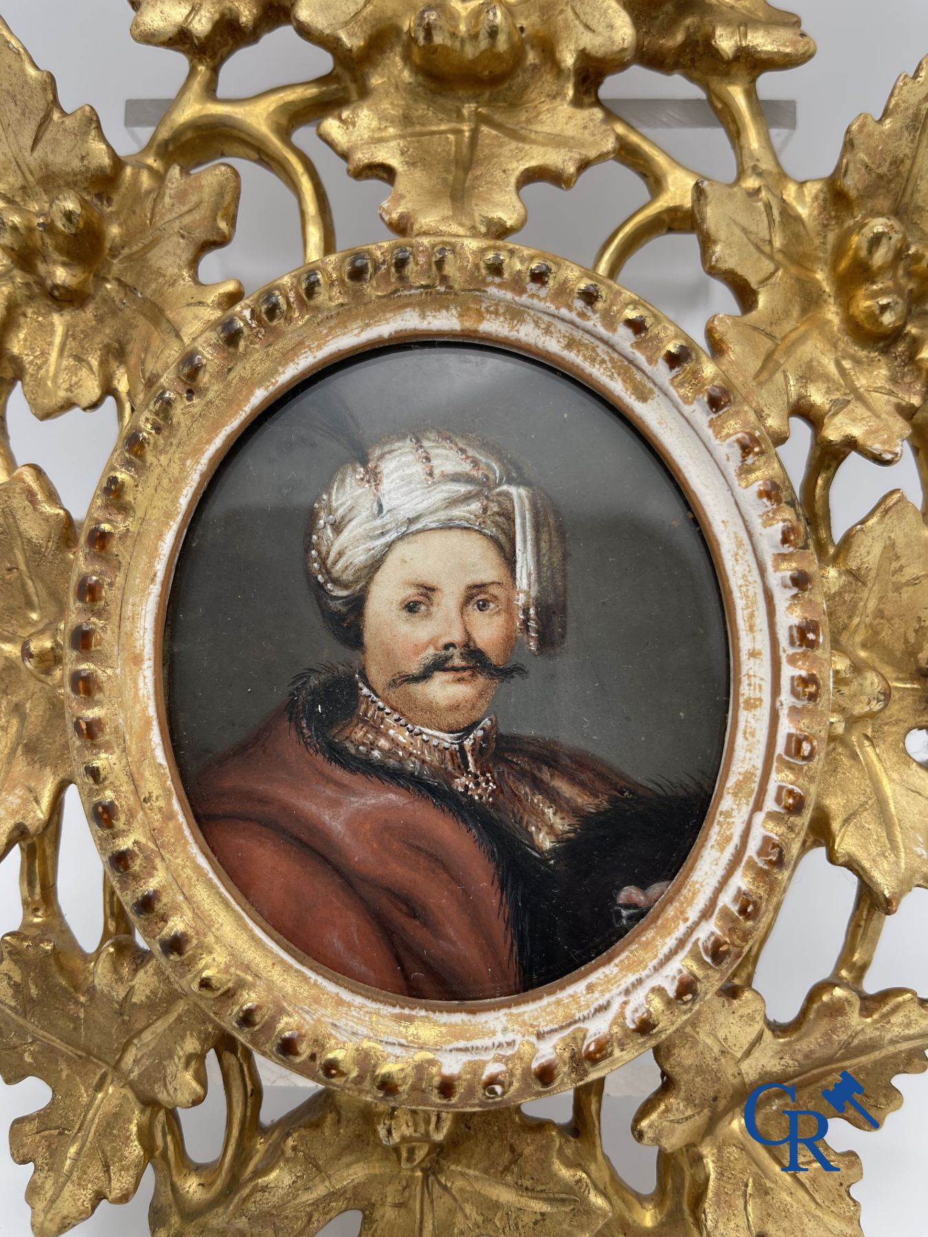 Miniature portrait in a gilded wood-carved frame. 19th century.