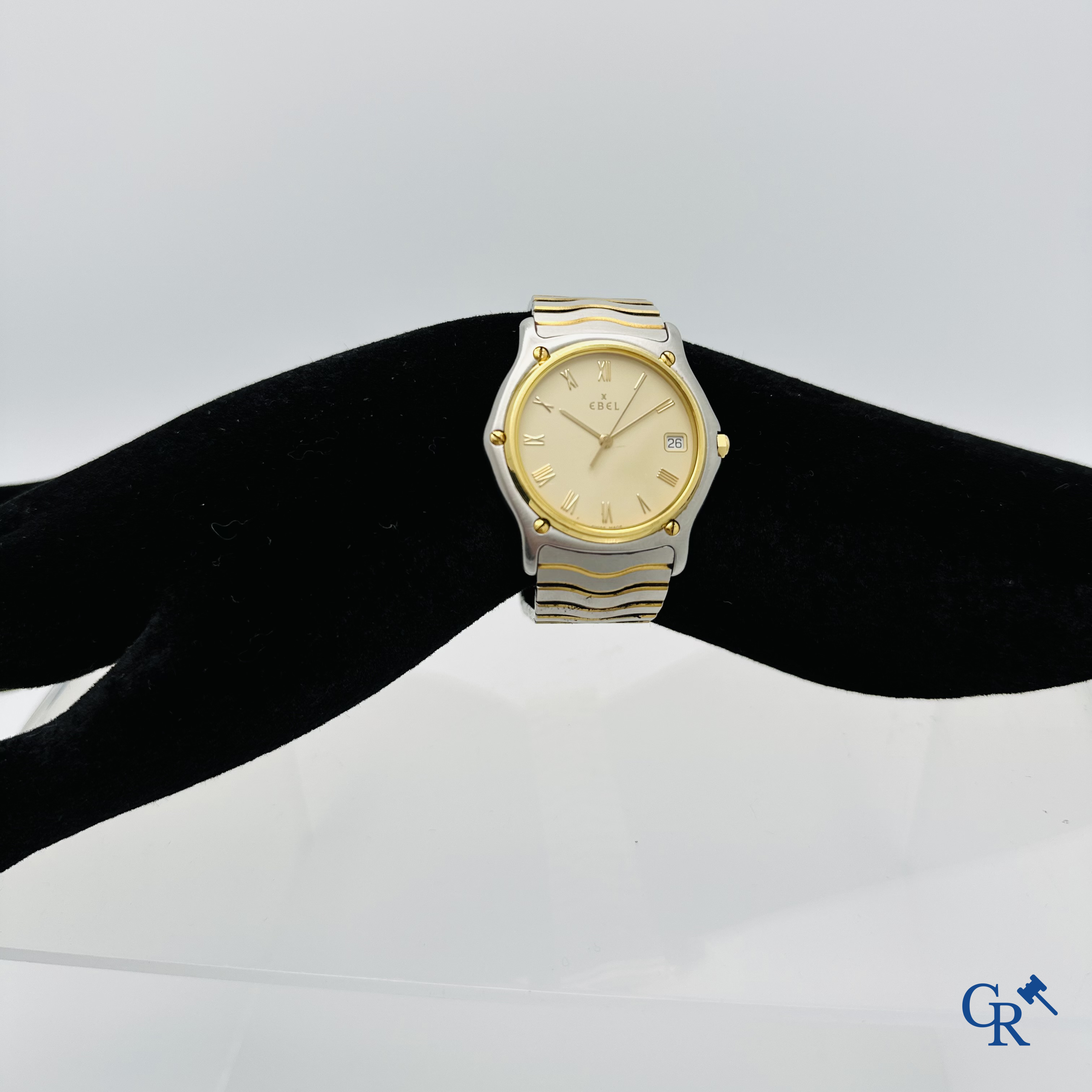 Ebel: Herenpolshorloge met armband in staal en bezel in goud 18K (750°00).