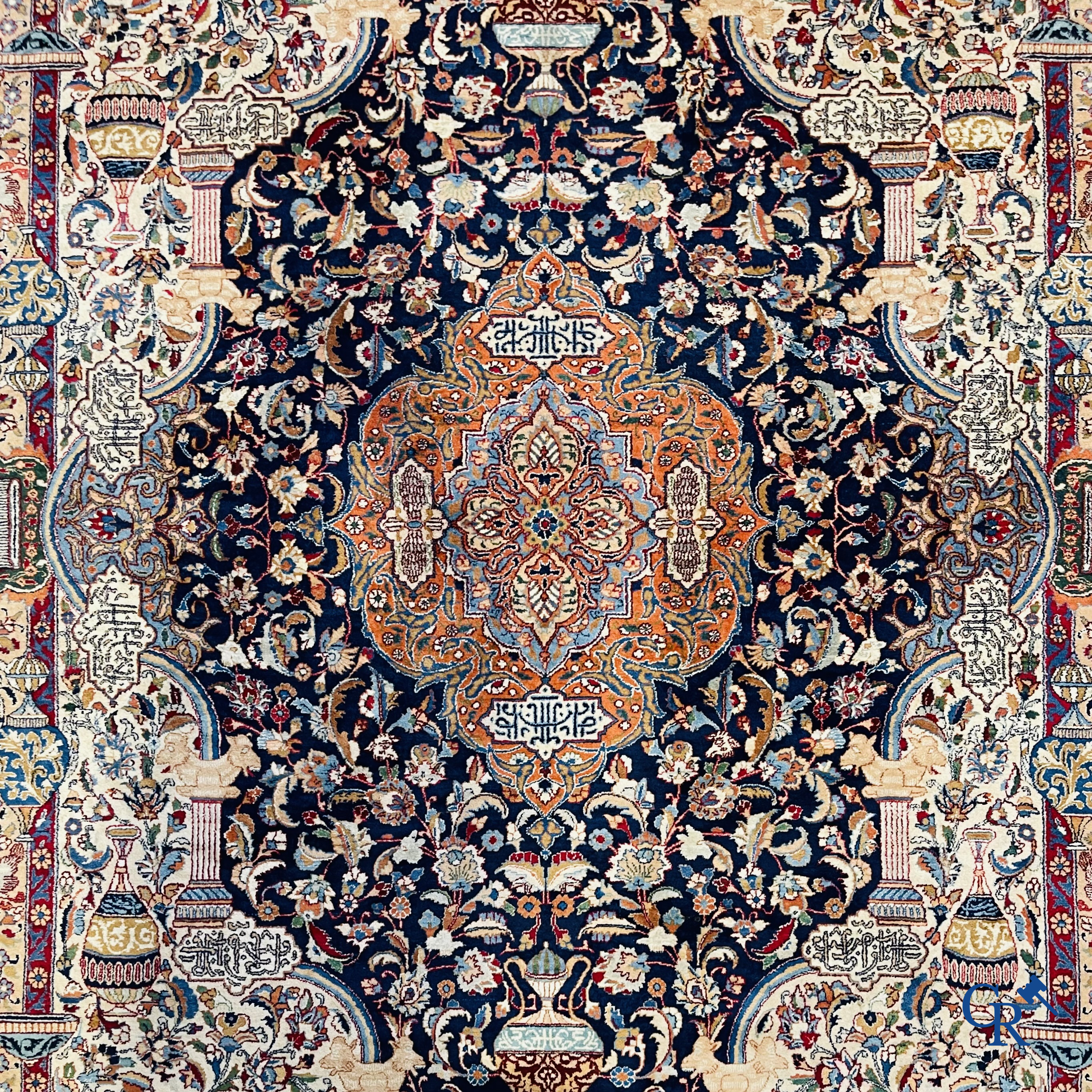 Oriental carpets: A large hand-knotted oriental carpet with antique decor. Multiple inscriptions.