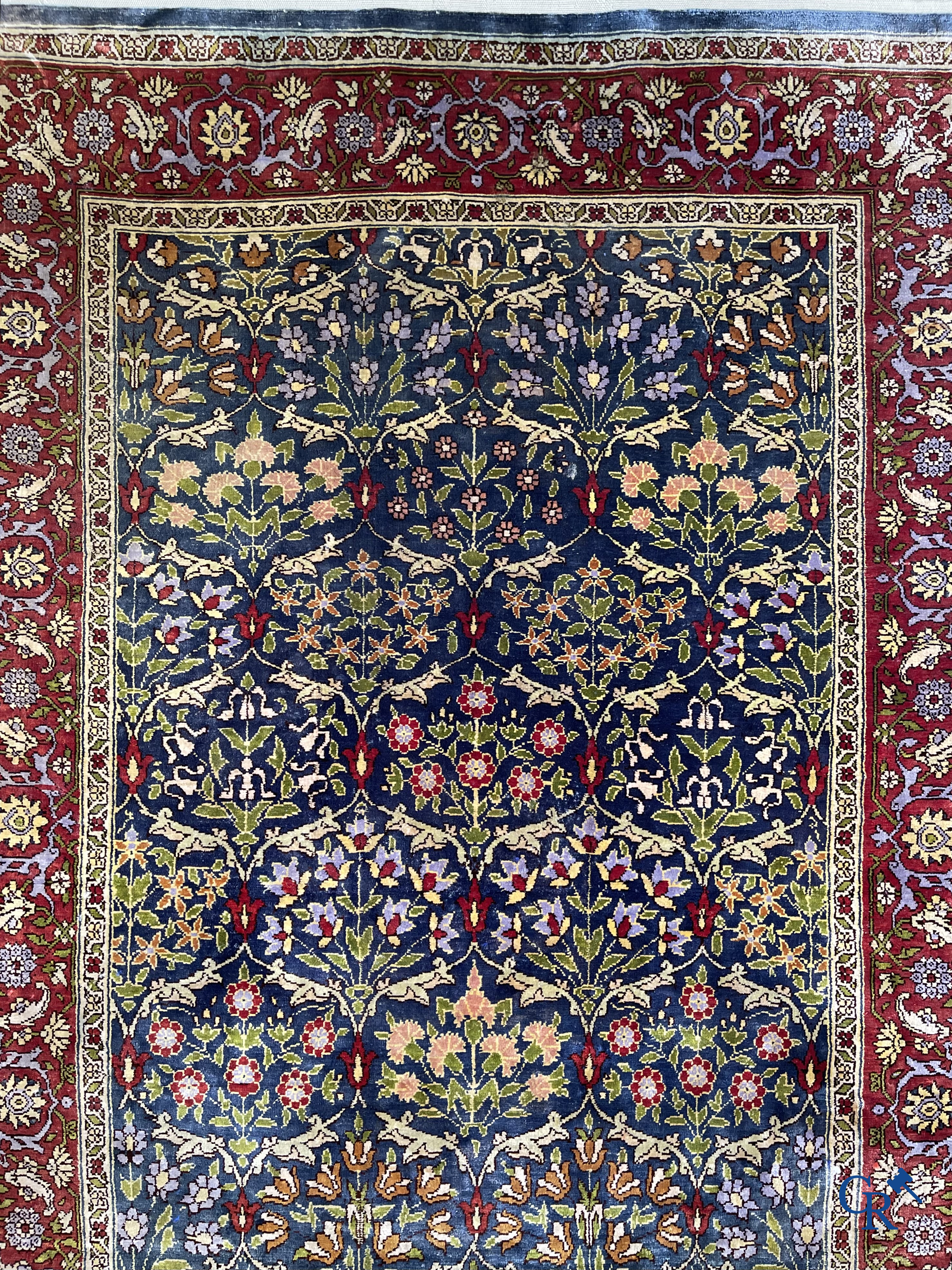 Oriental carpets, a finely hand-knotted silk carpet with floral decor.