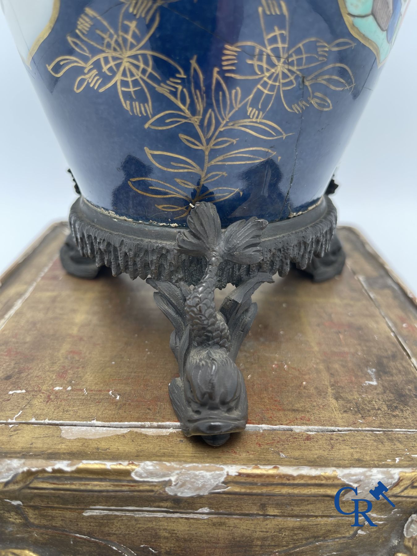 A porcelain table fountain with bronze fittings.