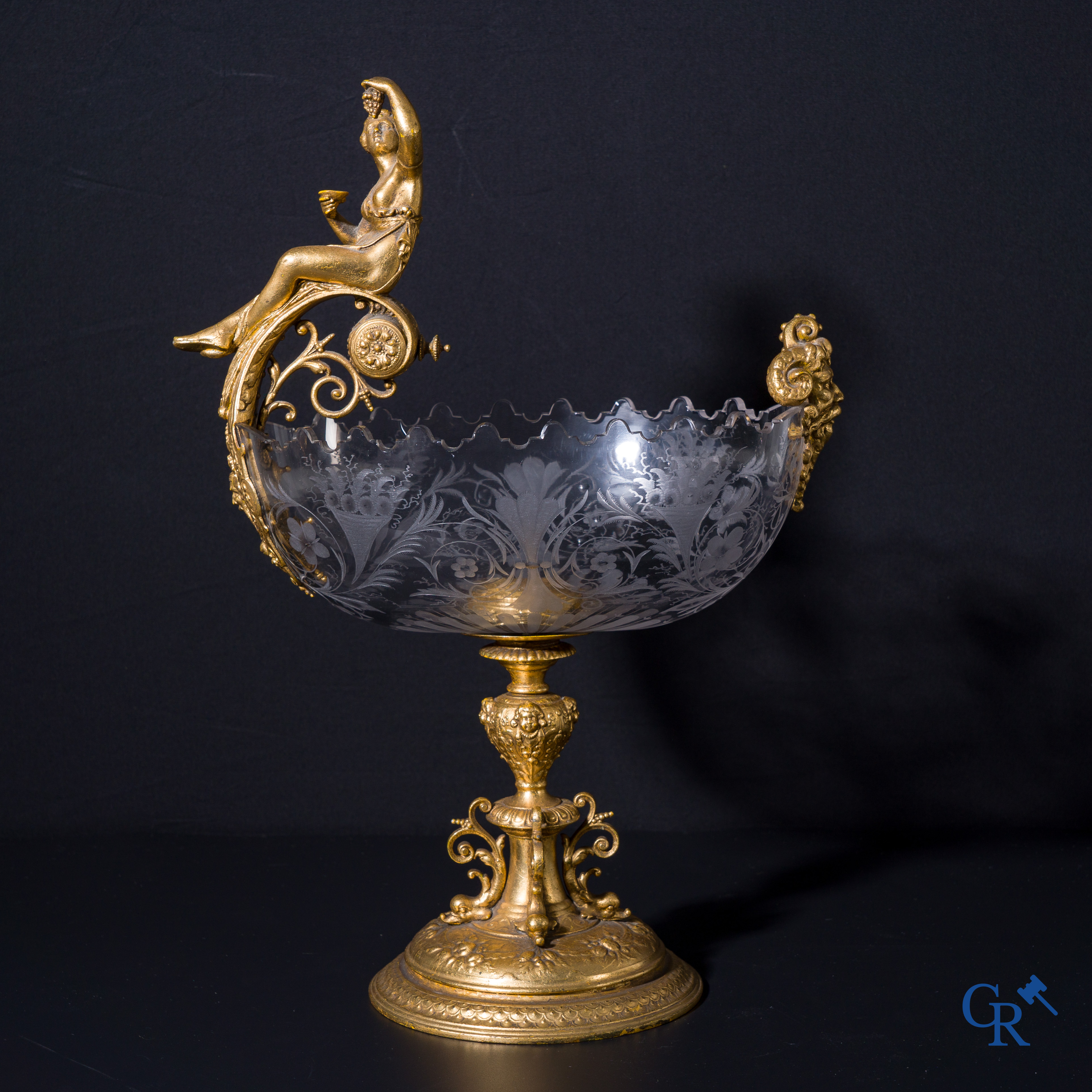 A gilded Renaissance-style table centerpiece with a richly cut crystal coupe. Late 19th century.