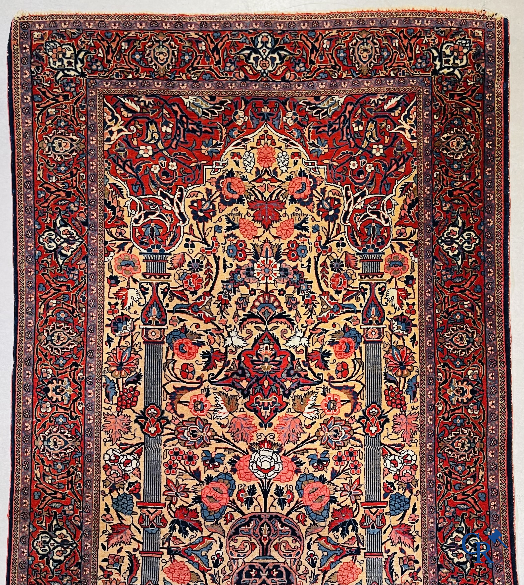 Oriental carpets: Iran. 2 antique hand-knotted Persian carpets with floral decor.