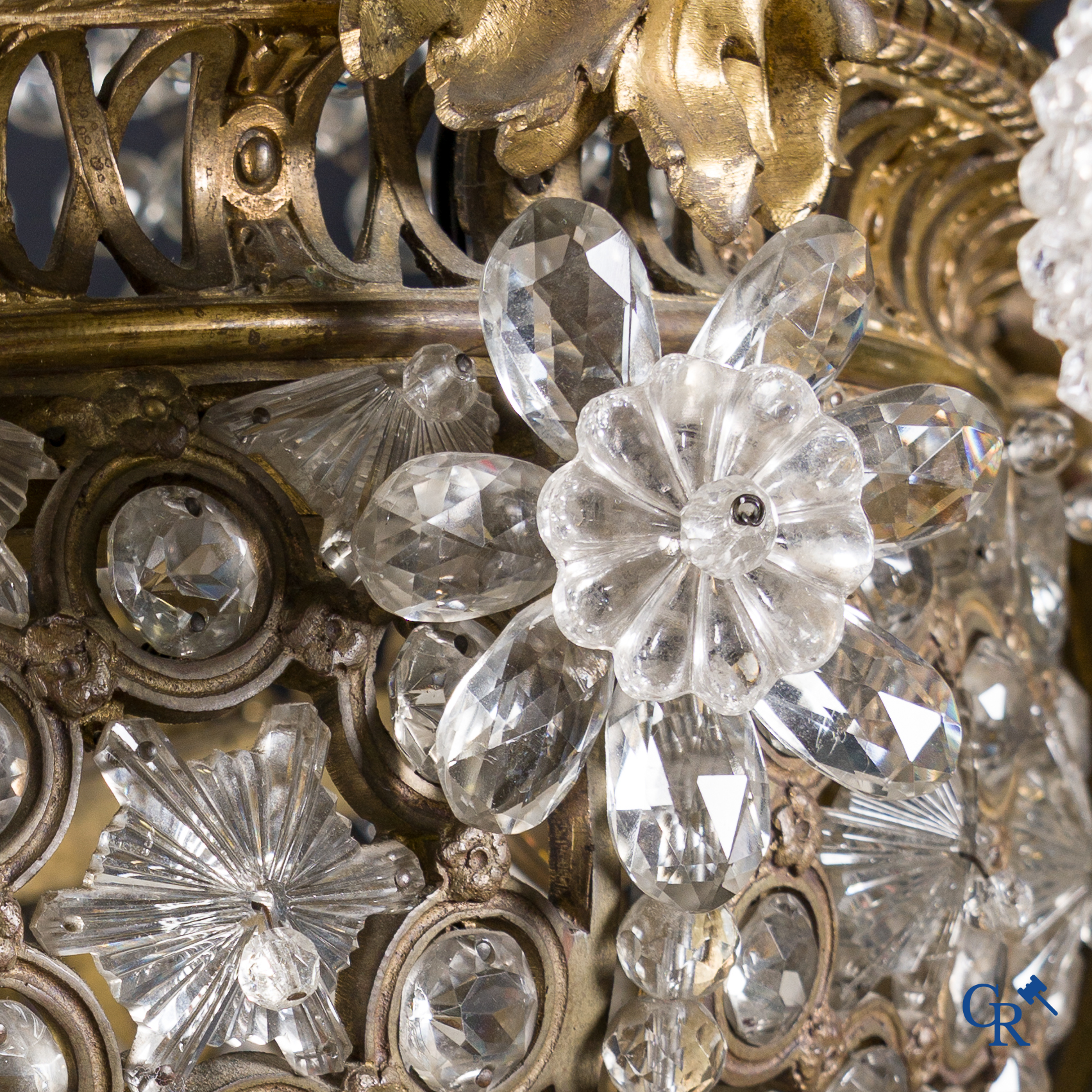 An imposing bronze and crystal chandelier in LXVI style. Circa 1920.