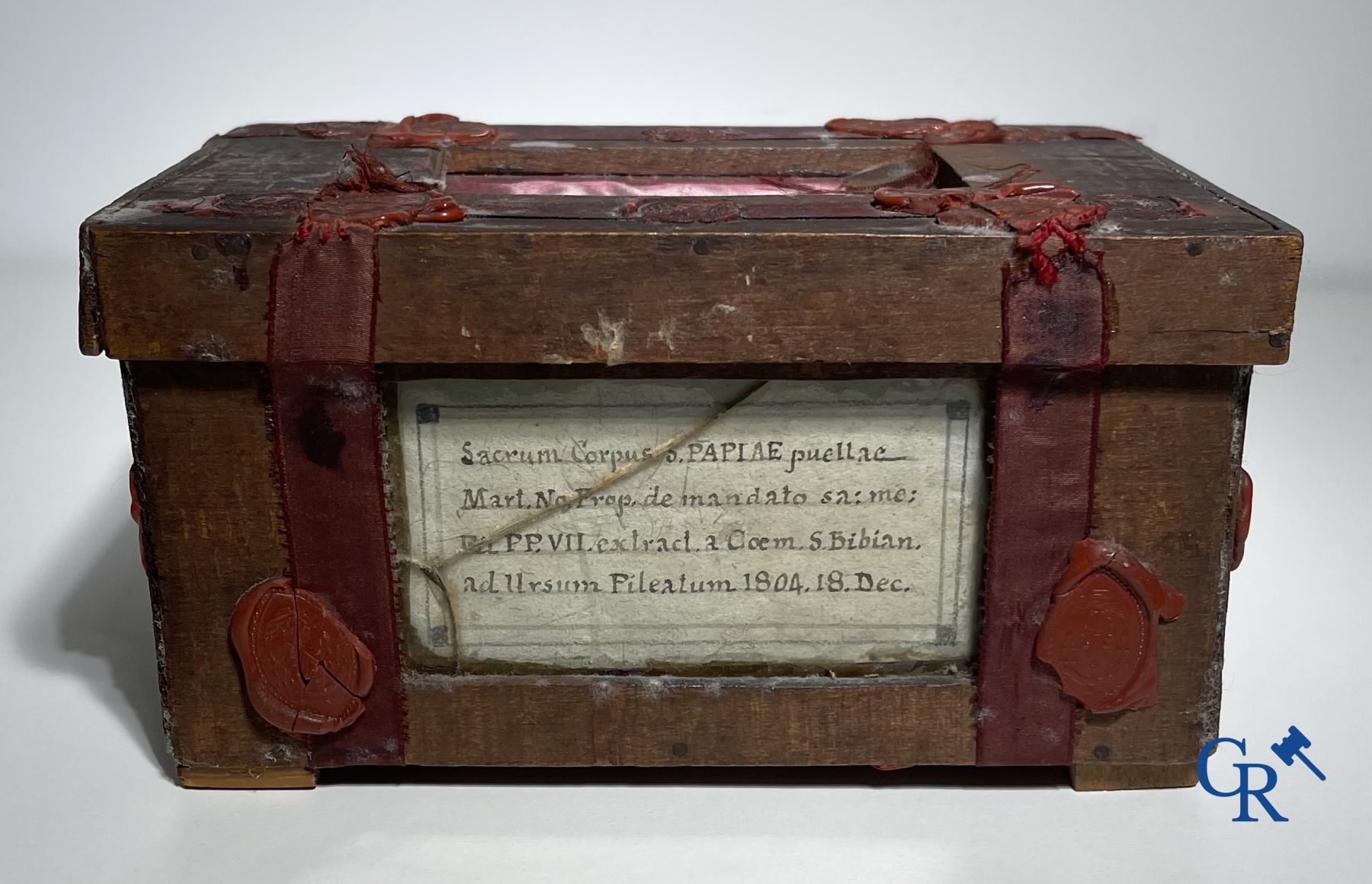 An antique wooden reliquary sealed with wax seals. Early 19th century.