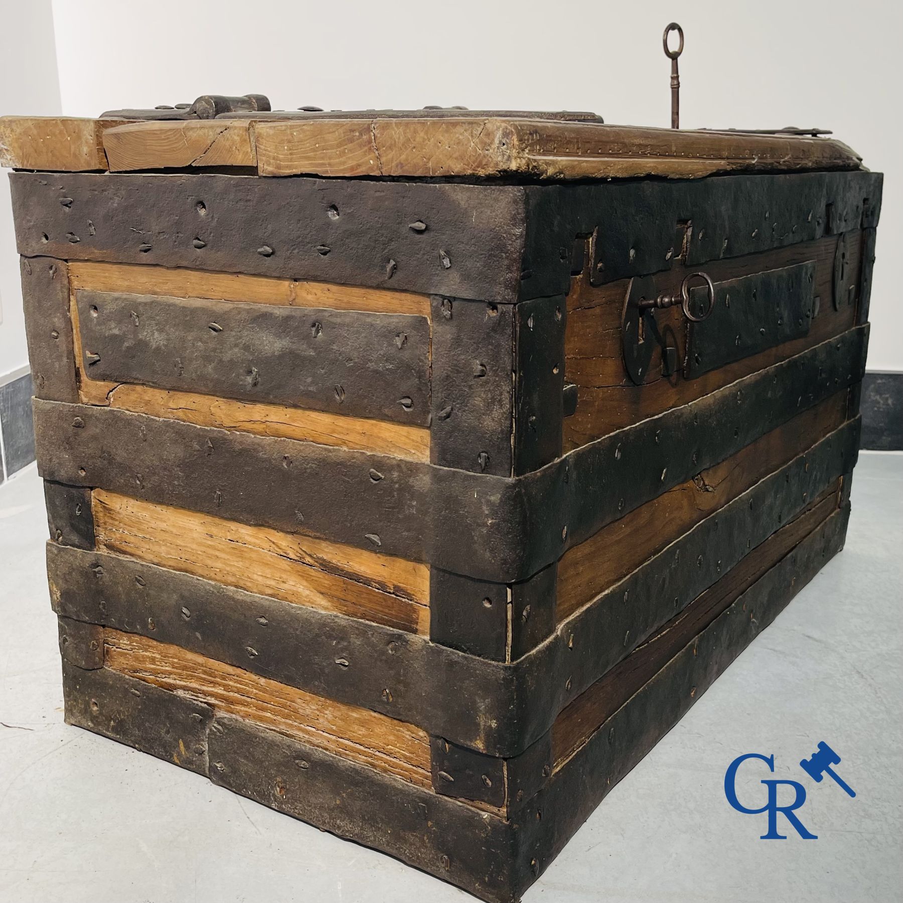 Antique wooden chest with hardware and lockwork in forging.