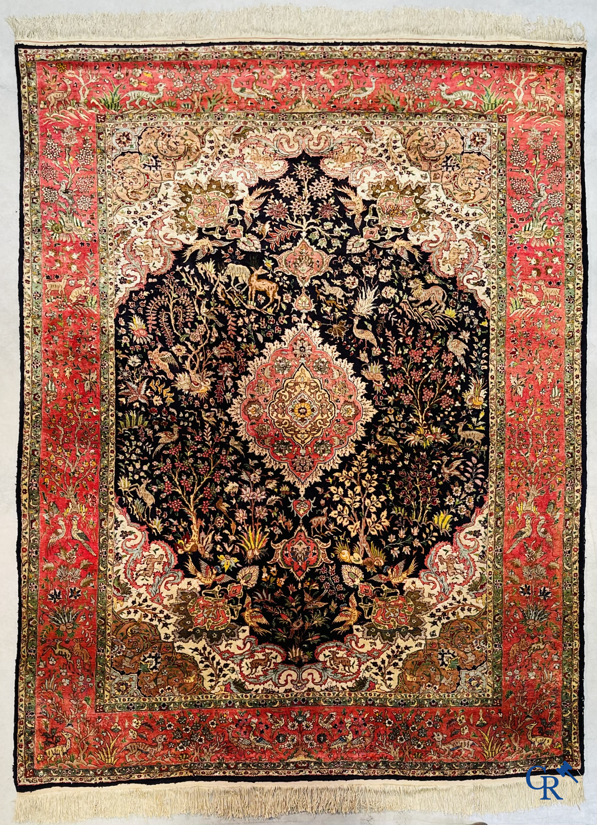 Oriental carpets: Tabriz, a finely hand-knotted silk carpet with forest animals and birds in a floral decor.