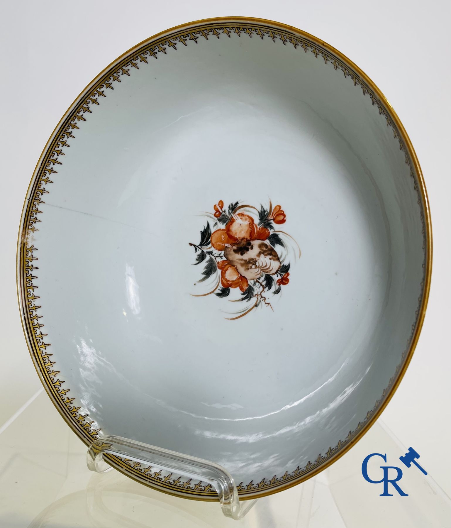 A large Chinese famille rose mandarin bowl, a famille rose cup and saucer and a figurine in blanc de chine.