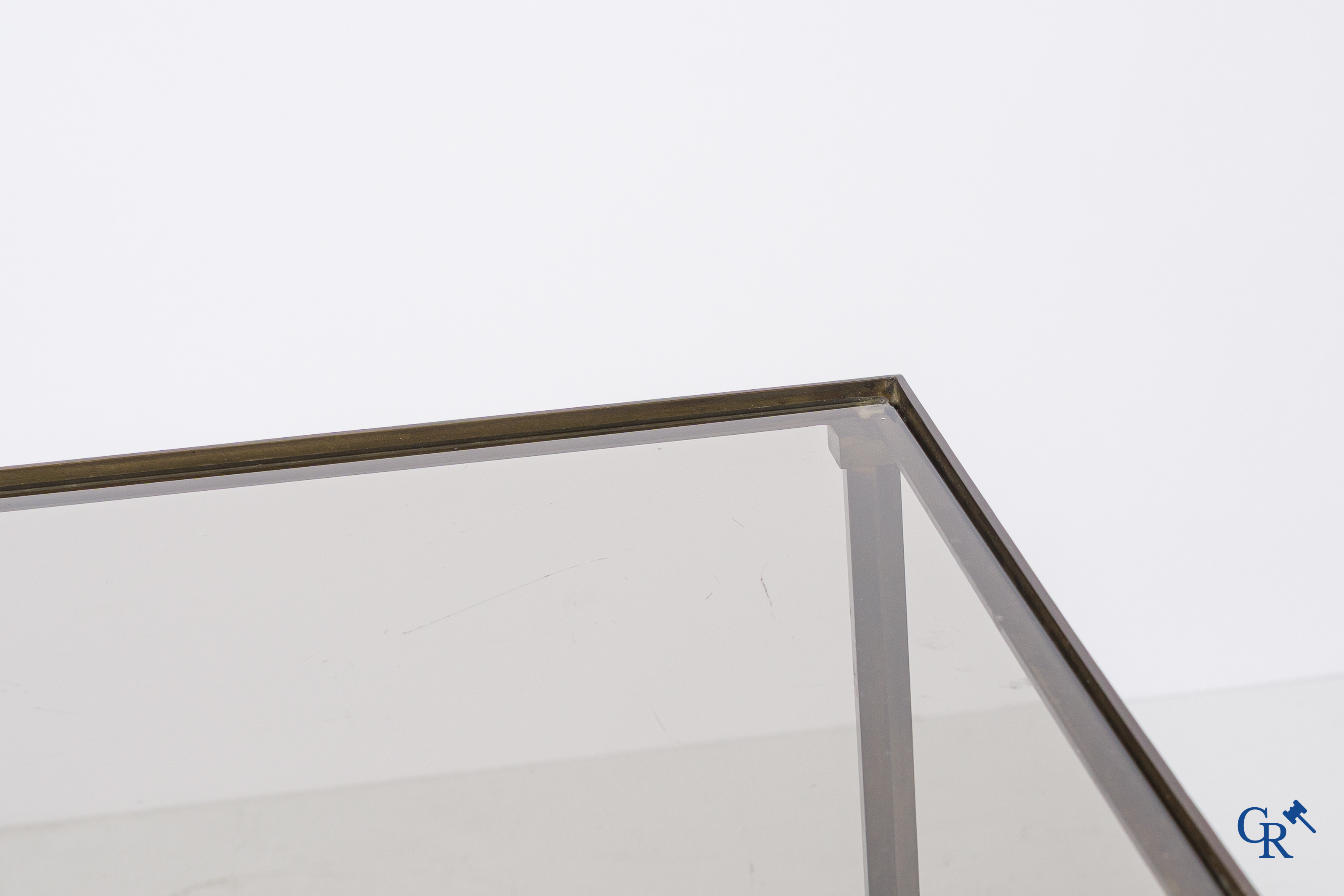 A pair of side tables in bronze and glass. Around 1960.