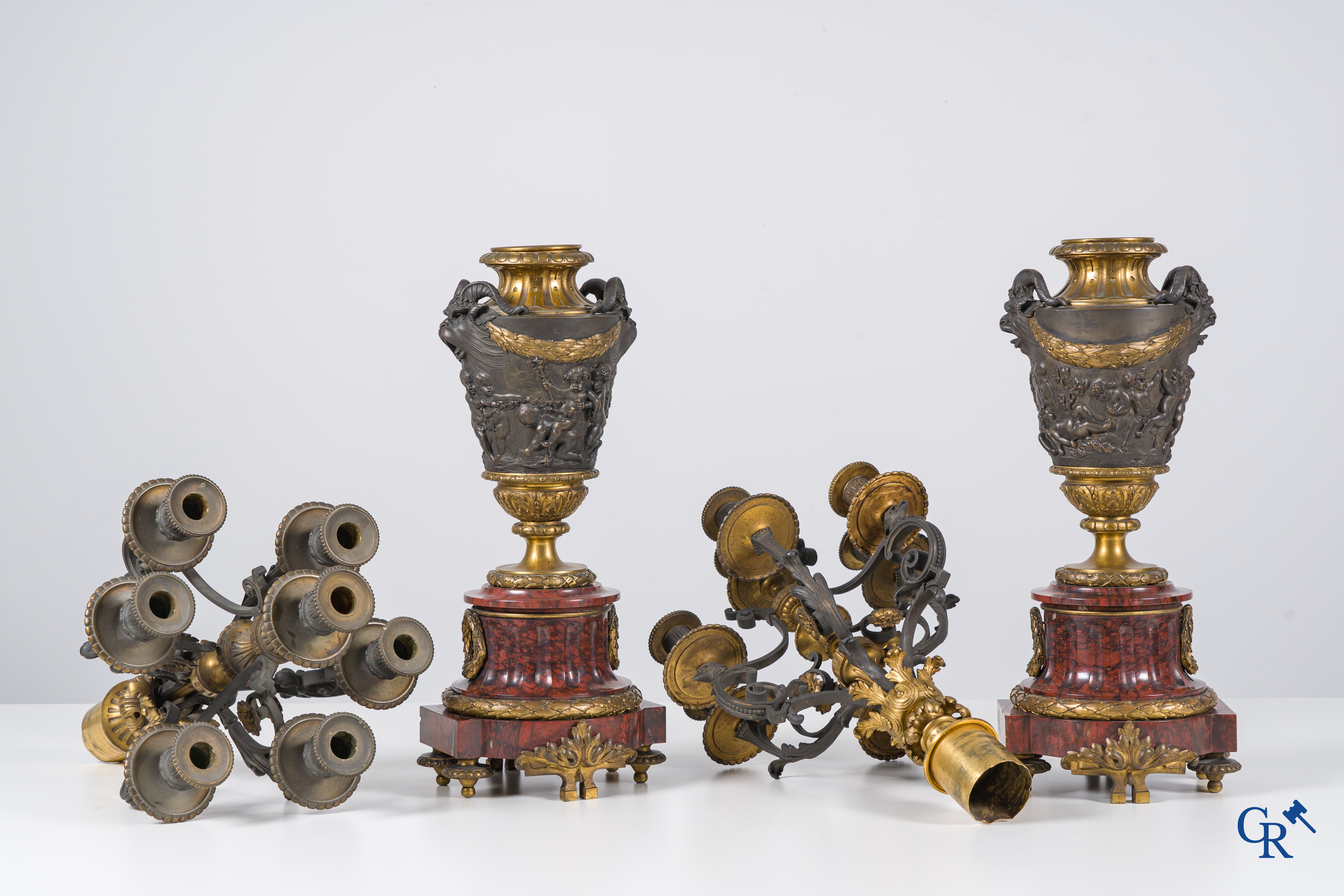 Charpentier à Paris, An imposing 3-piece fireplace clockset in gilded and patinated bronze. Late 19th century.