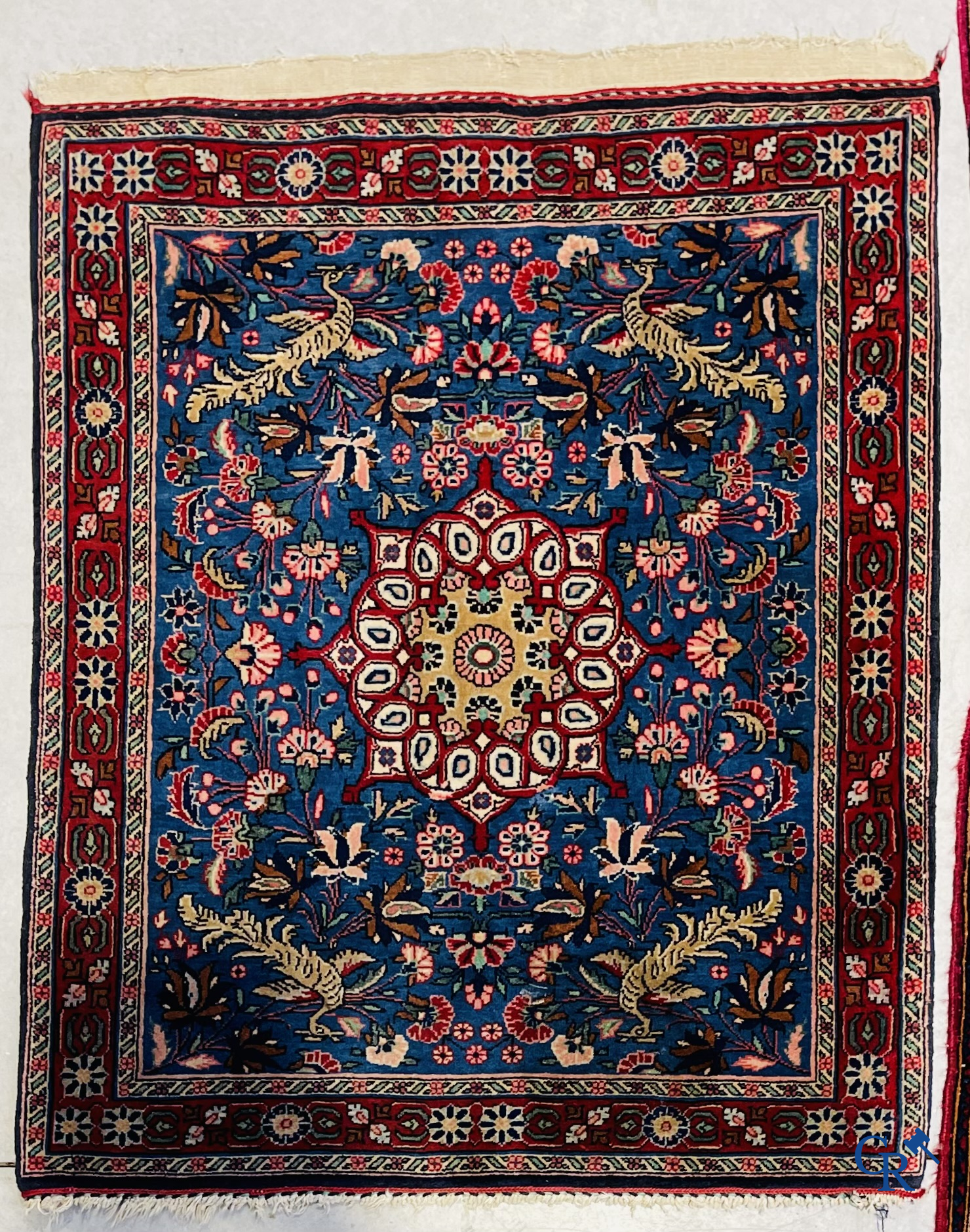 Persian carpets: A lot of 2 finely knotted Oriental carpets. Floral decor and floral decor with birds of paradise.