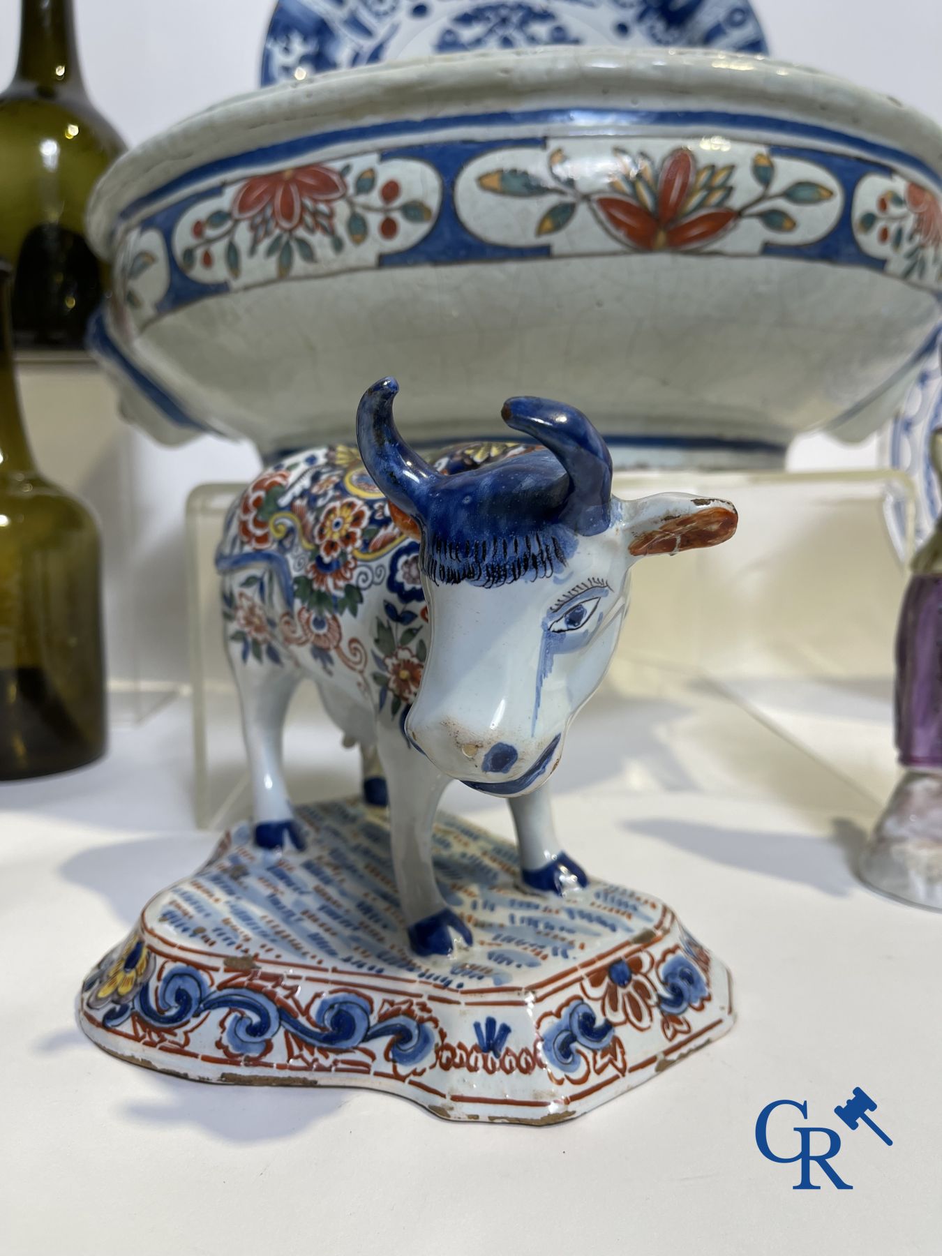 A part of a North French fountain and various pieces in faience and various antiques.