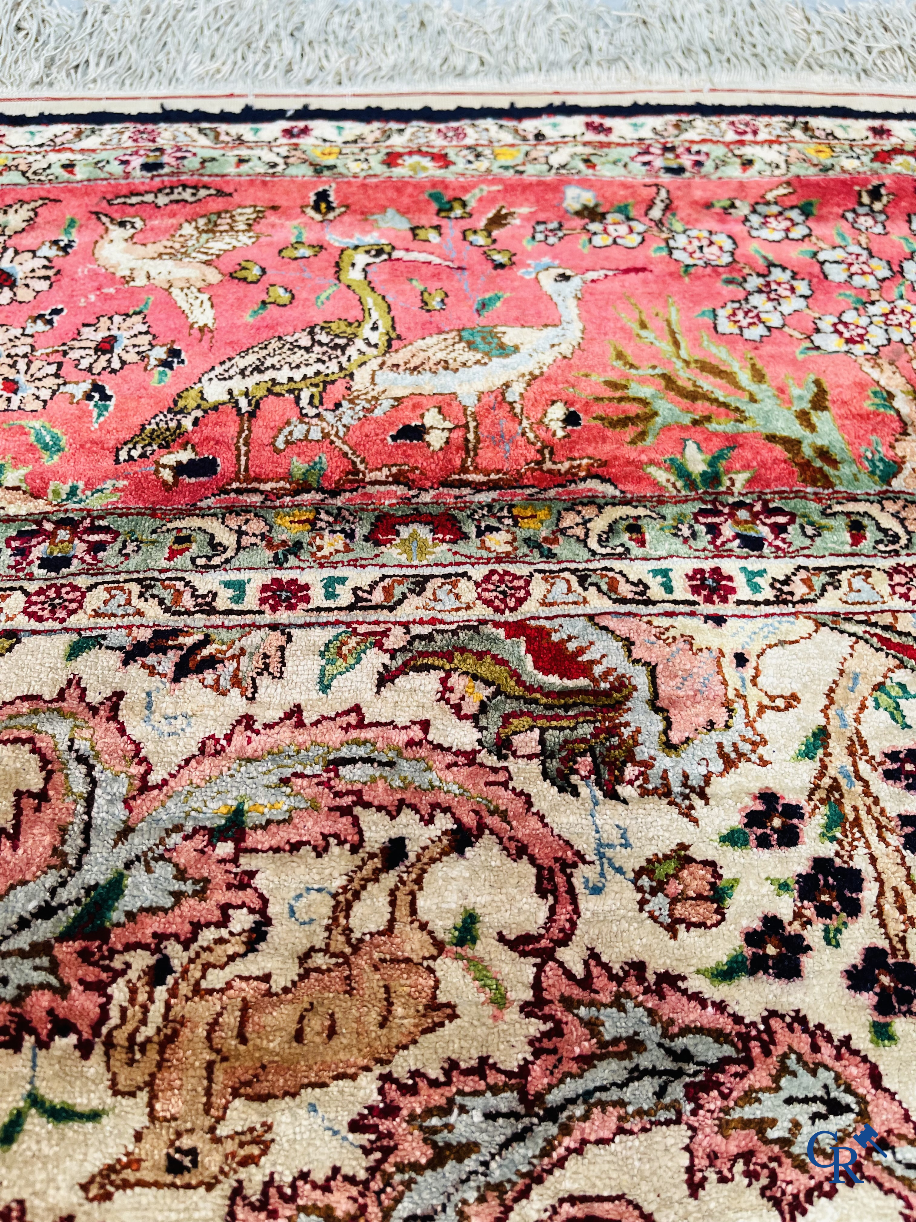 Oriental carpets: Tabriz, a finely hand-knotted silk carpet with forest animals and birds in a floral decor.