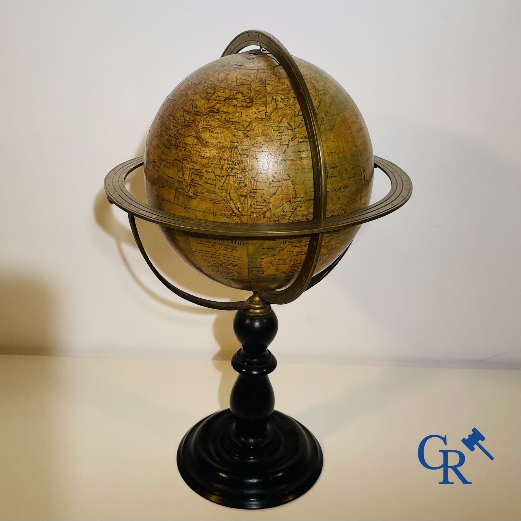 An antique globe with meridian circle on a black lacquered wooden base. 19th century.