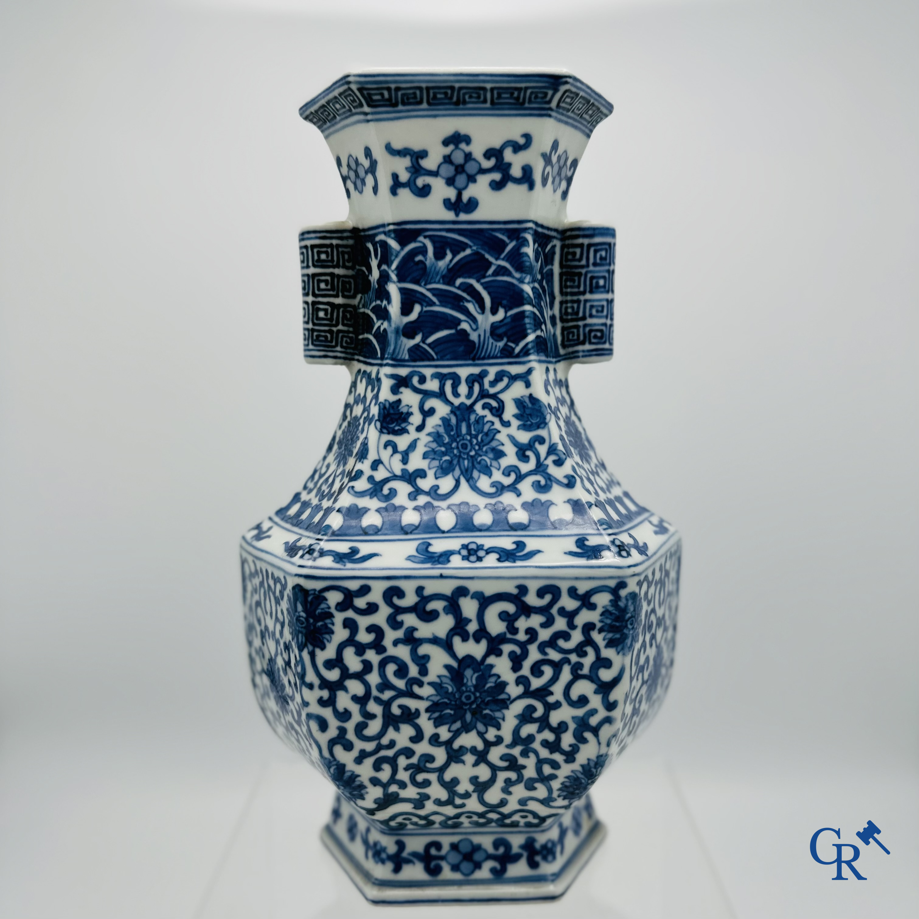 Chinese porcelain: Chinese blue and white vase with floral decor.