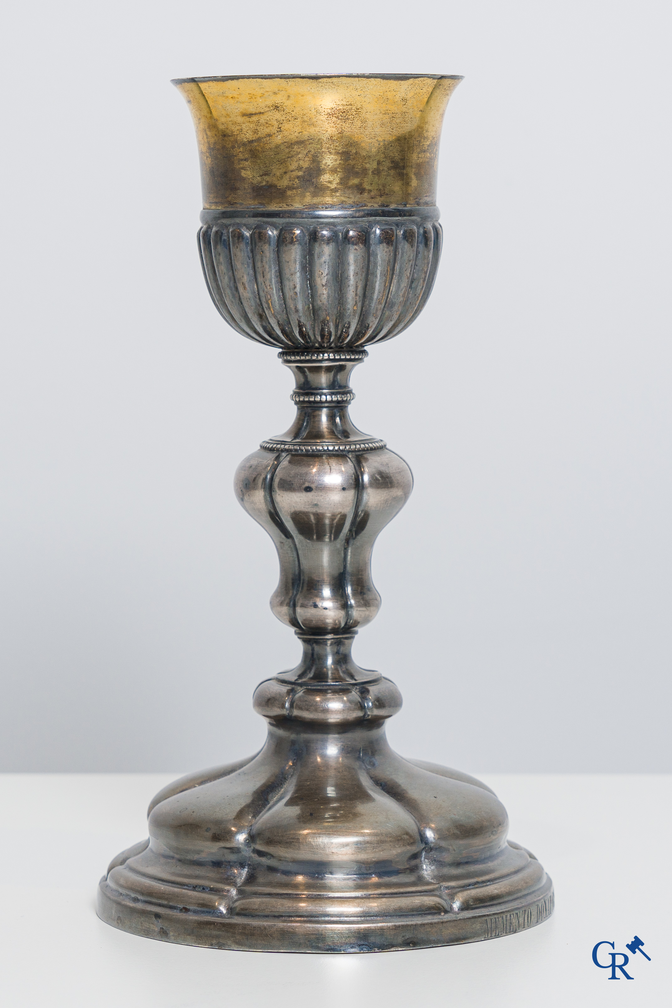 Religious objects. A silver- and gold plated chalice with Memento Donatoris inscriptions.