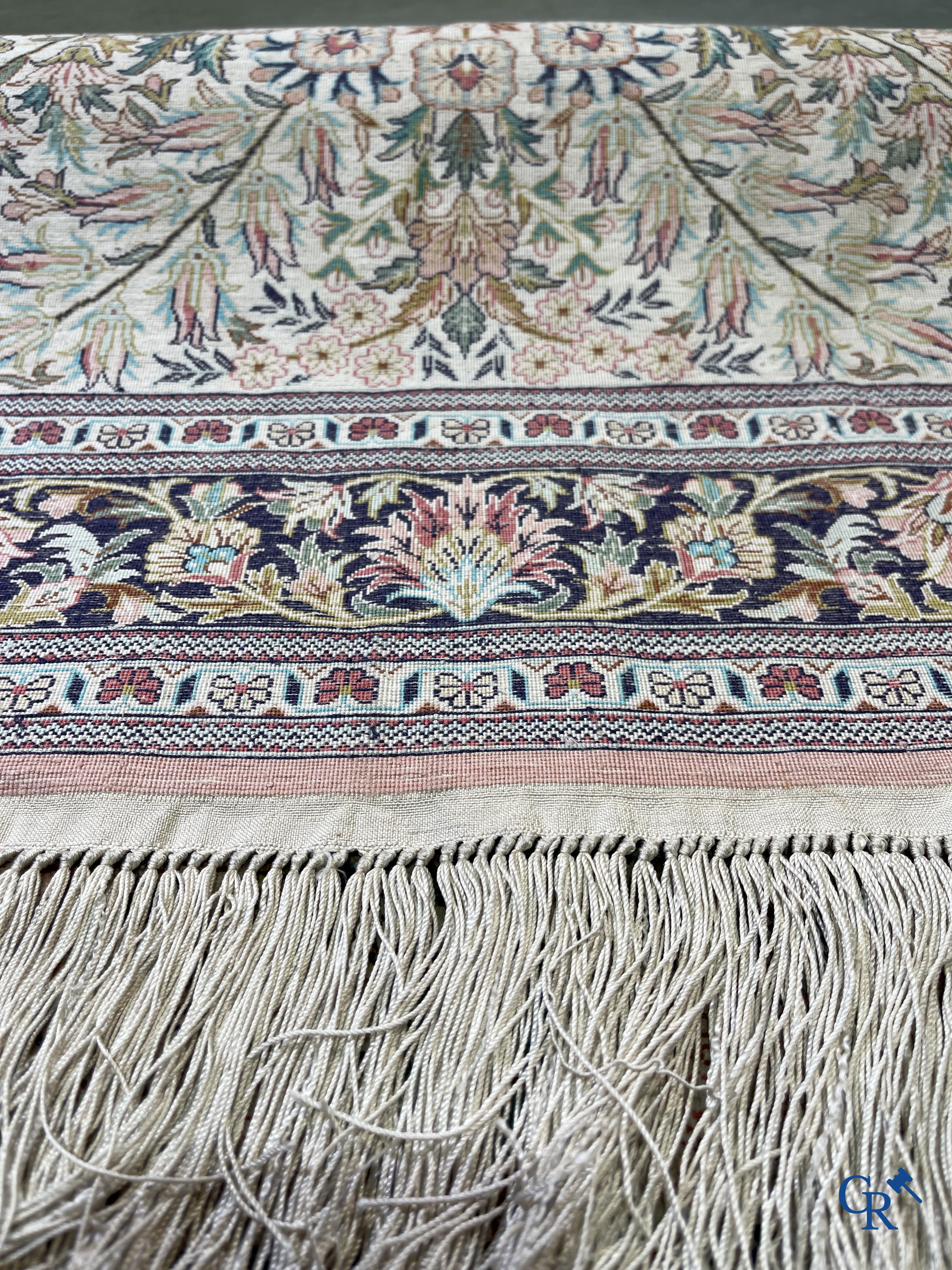 Oriental rugs: A finely hand-knotted silk Persian rug with a flower vase and birds in a floral decor.