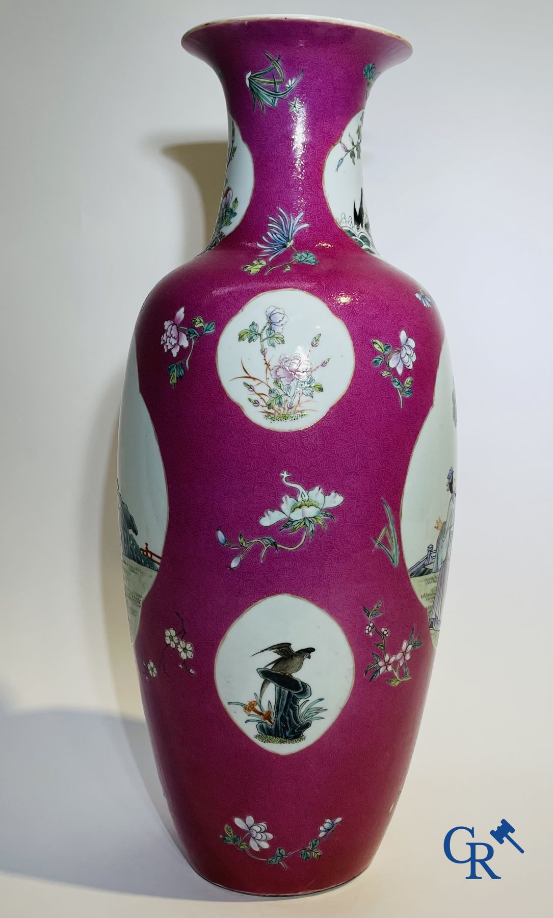 Chinese porcelain: A fine famille rose vase decorated on a red ruby background in sgraffito technique.