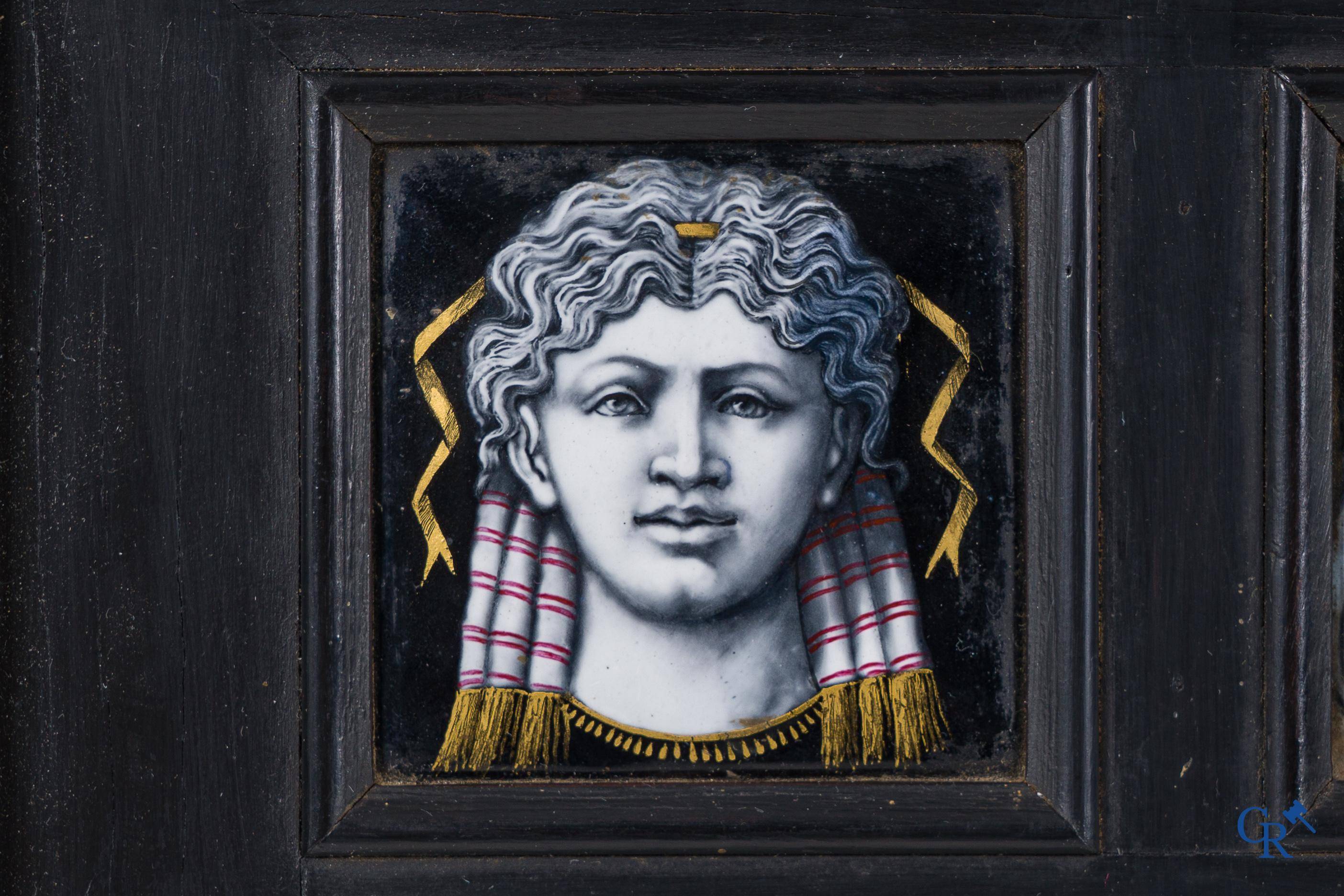 Limoges. Large frame in ebony veneer with 9 enamelled representations on copper. 18th-19th century.