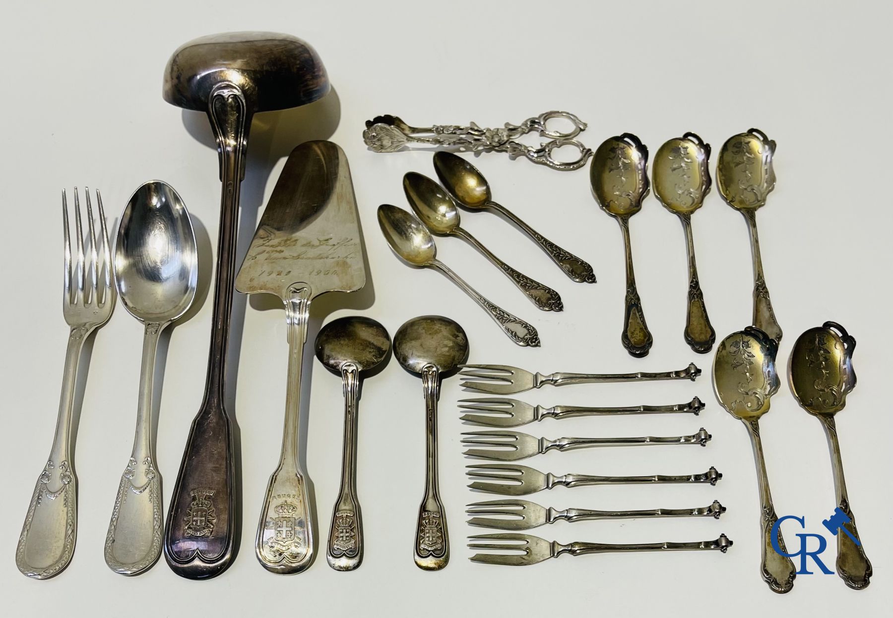 Silver: A lot of silver cutlery, a cake scoop and others including Delheid.