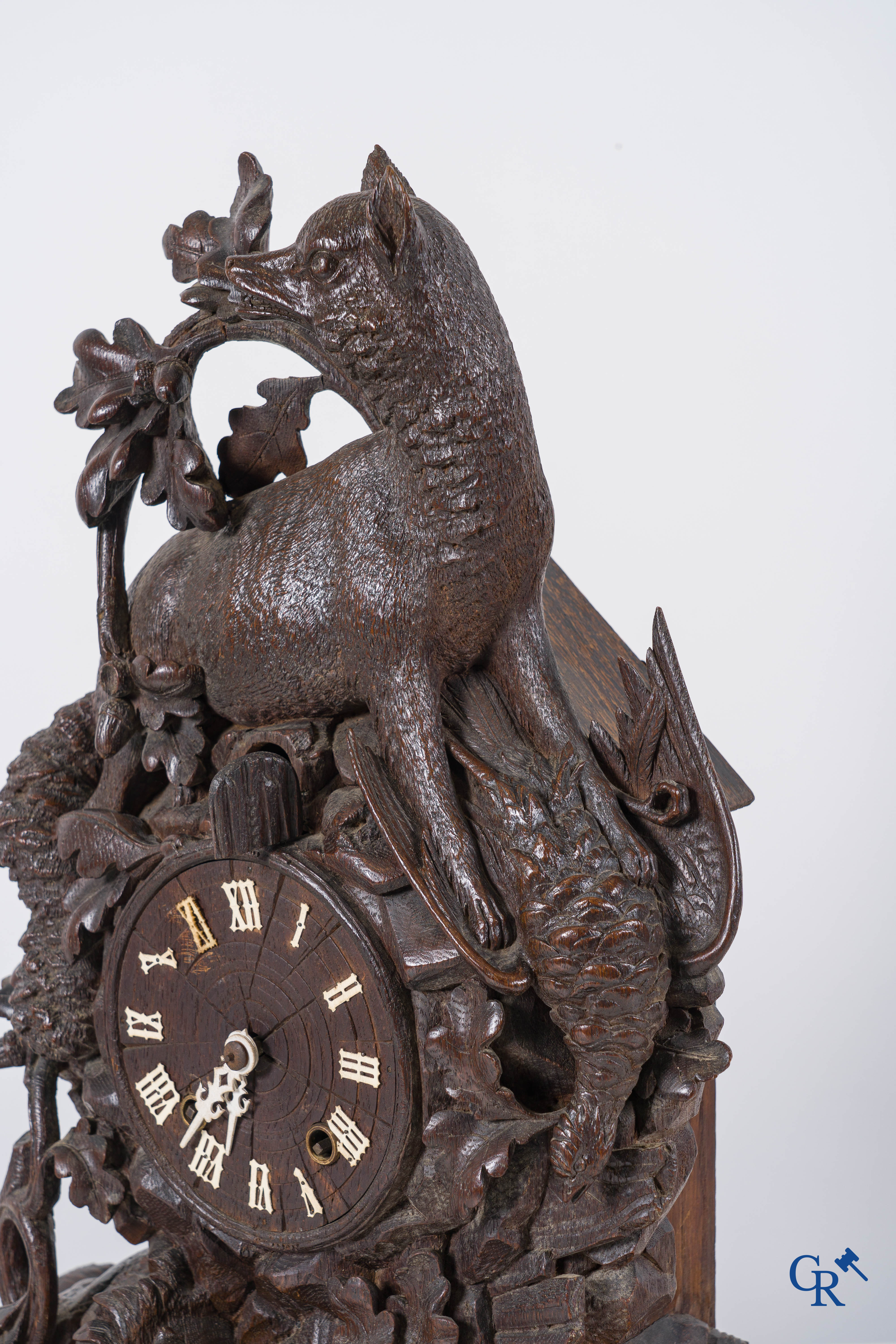 Black Forest, circa 1900. A large 3-piece cuckoo clock in sculpted wood.