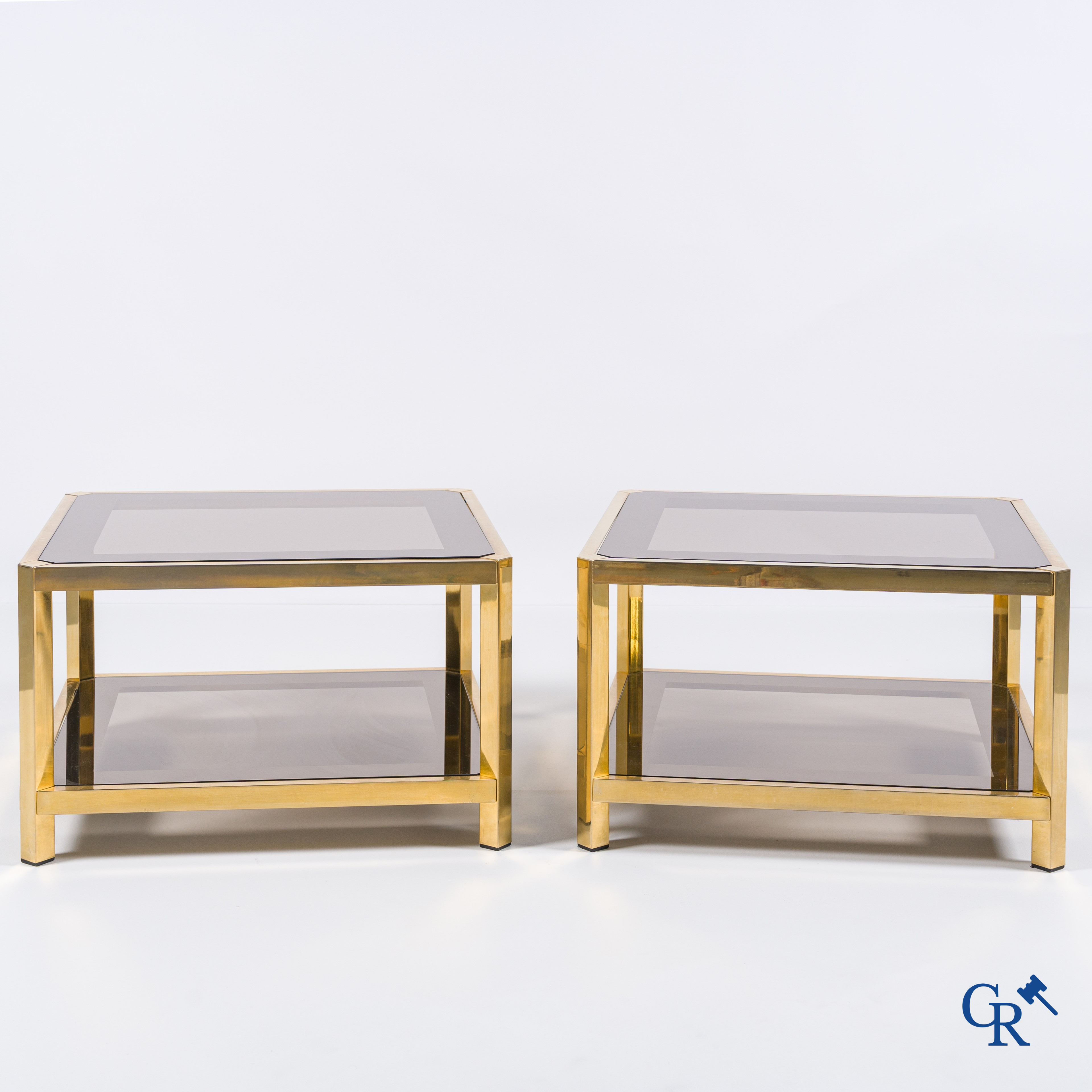 Design: Belgochrom, a pair of side tables (bouts de canapé) in gold-plated brass and glass, circa 1980.