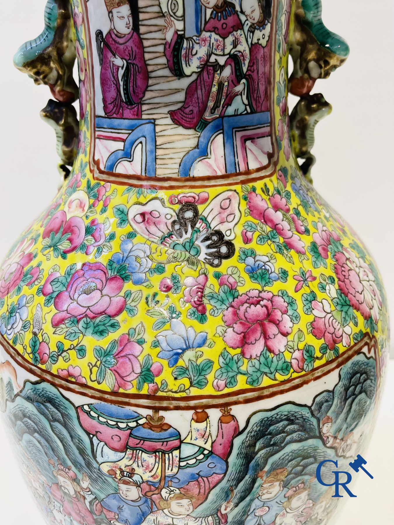 Asian art: A pair of Chinese famille rose vases with yellow background with court scenes. 19th century.