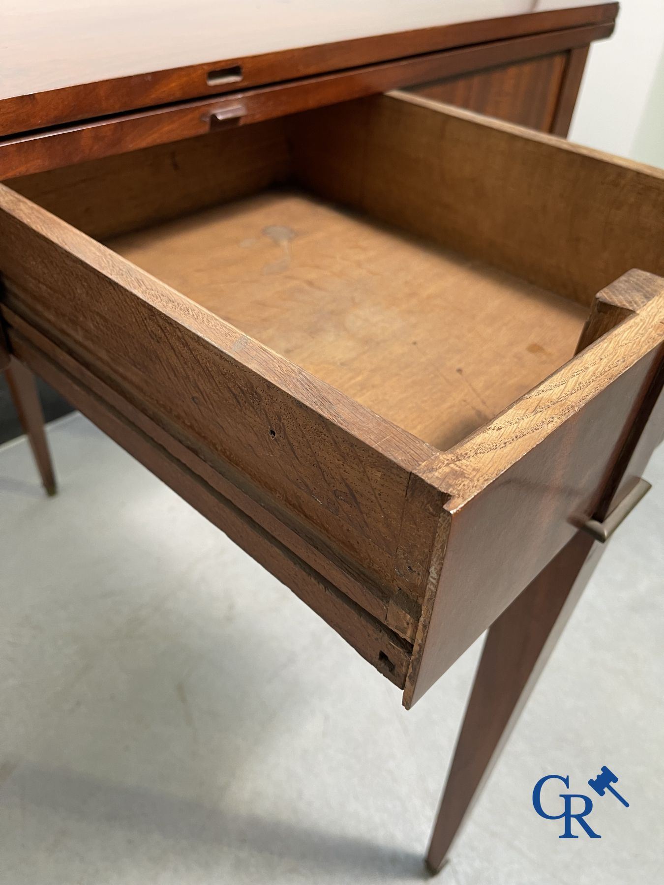 Furniture: fold-out crescent-shaped mahogany table. Directoire period.