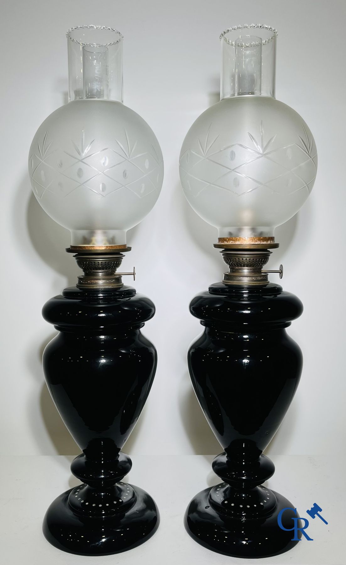 Pair of oil lamps in black opaline with enamelled decor.