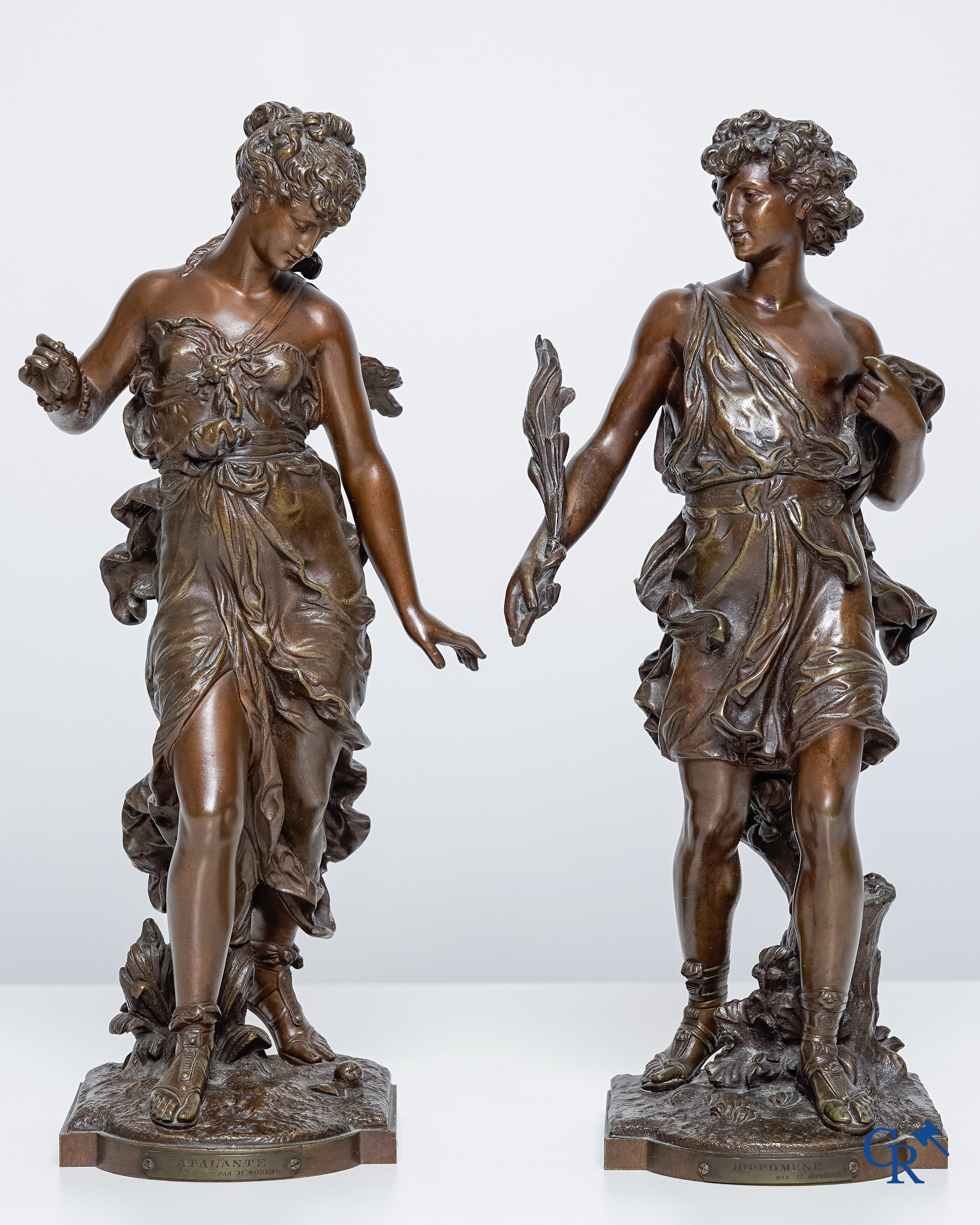 Hippolyte Moreau (1832-1927) Hippomène et Atalante. Paire de statues en bronze à la patine brune.