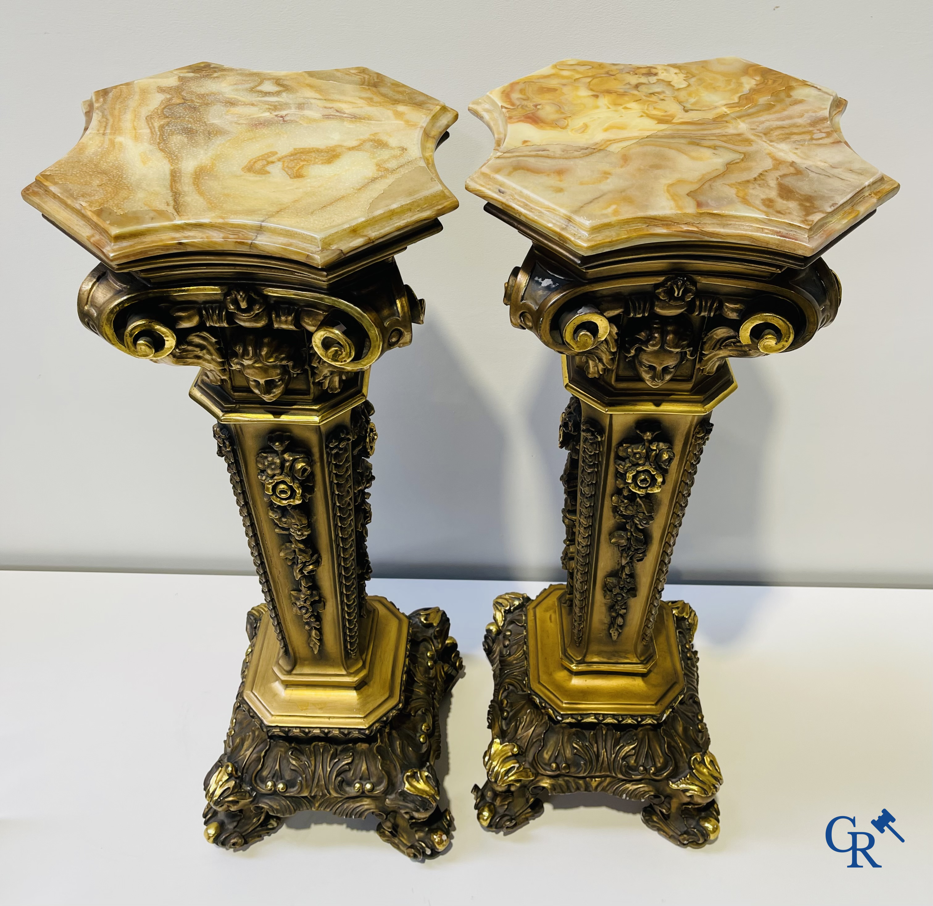 Pair of decorative gilded pedestals with onix top.