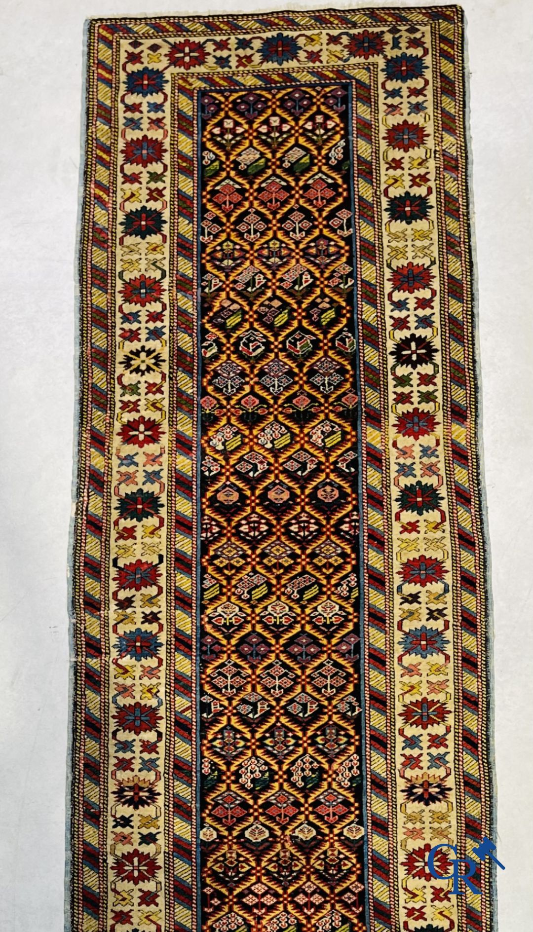 Oriental carpets: An antique oriental runner.