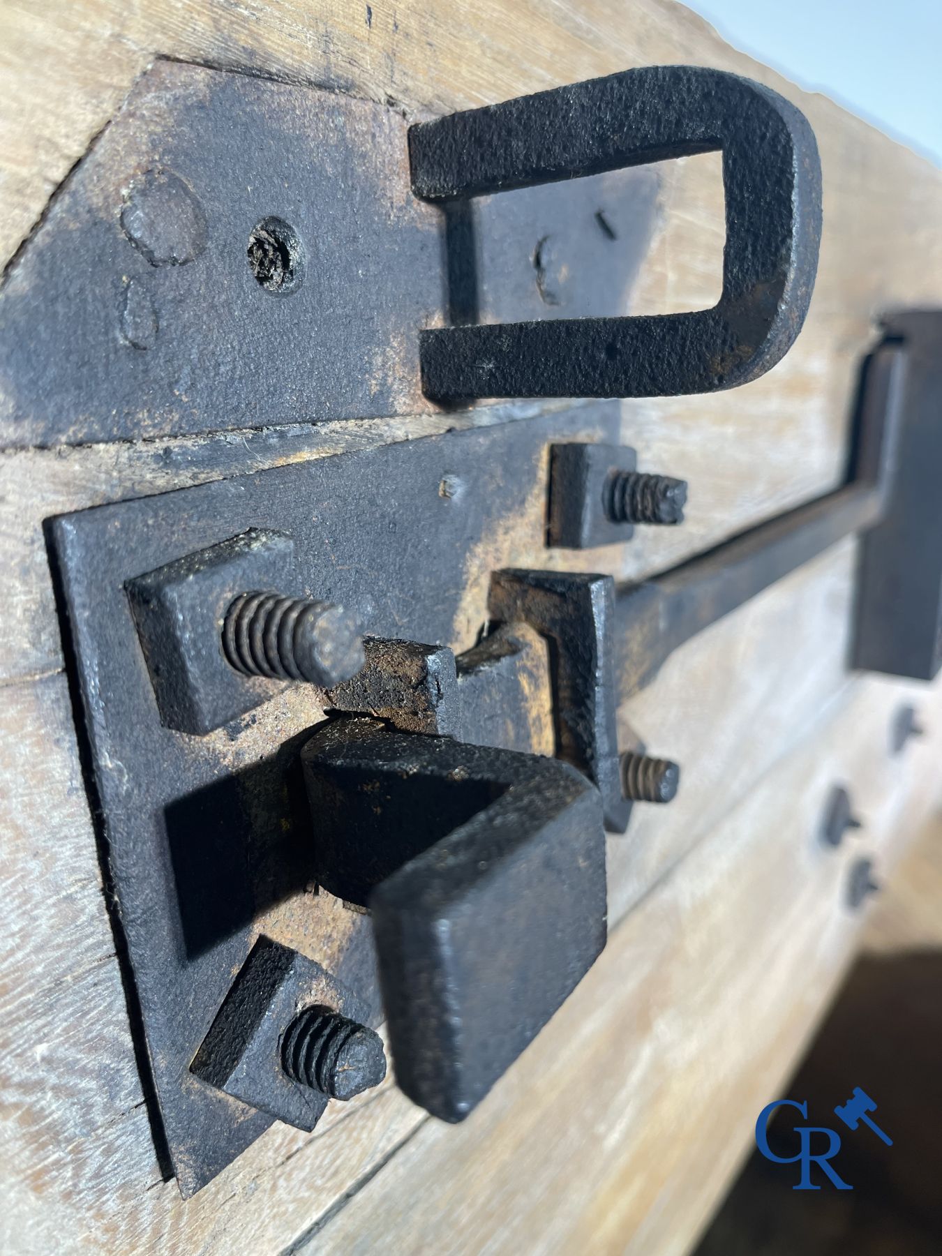 Antique wooden chest with hardware and lockwork in forging.