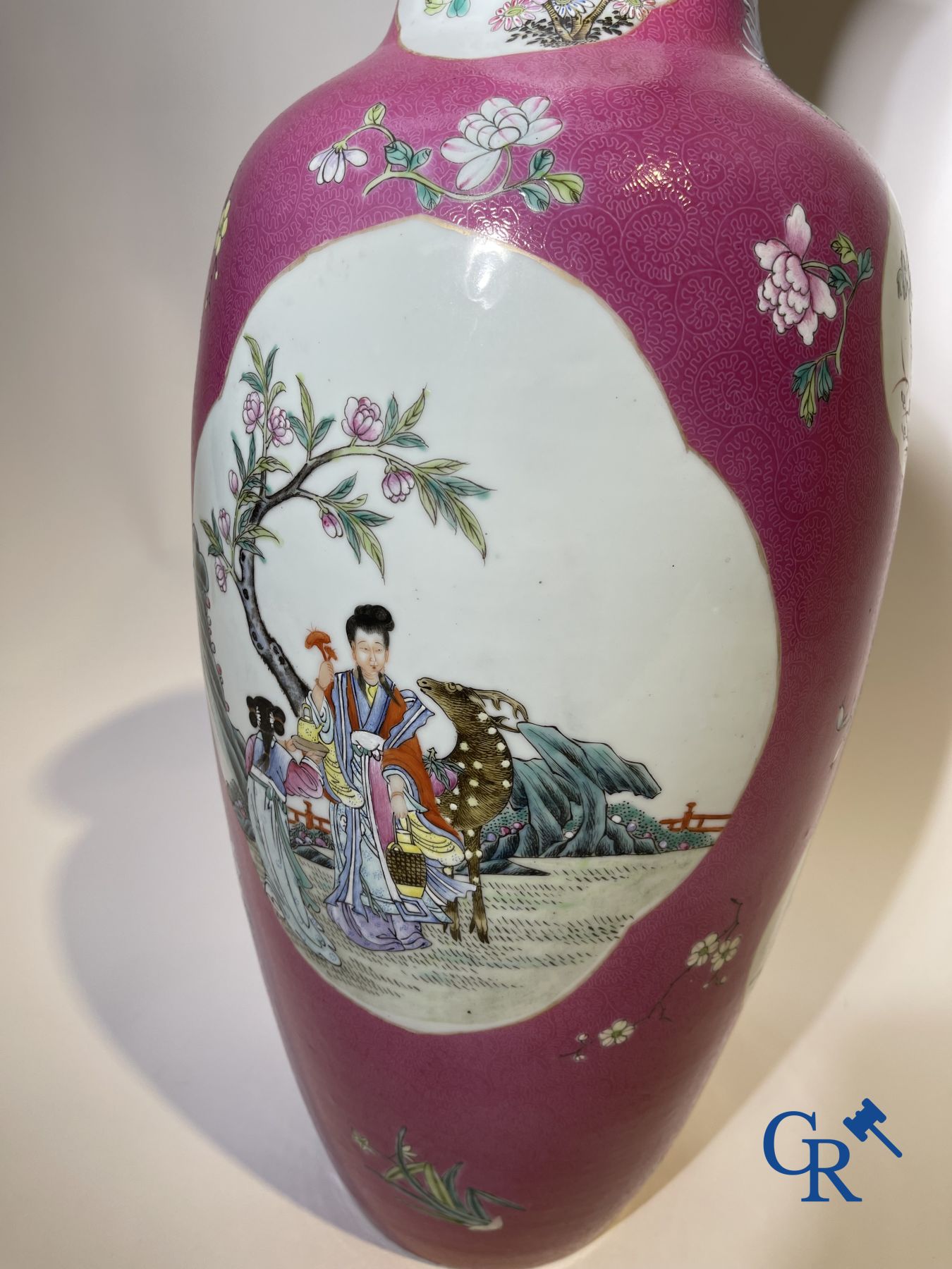 Chinese porcelain: A fine famille rose vase decorated on a red ruby background in sgraffito technique.