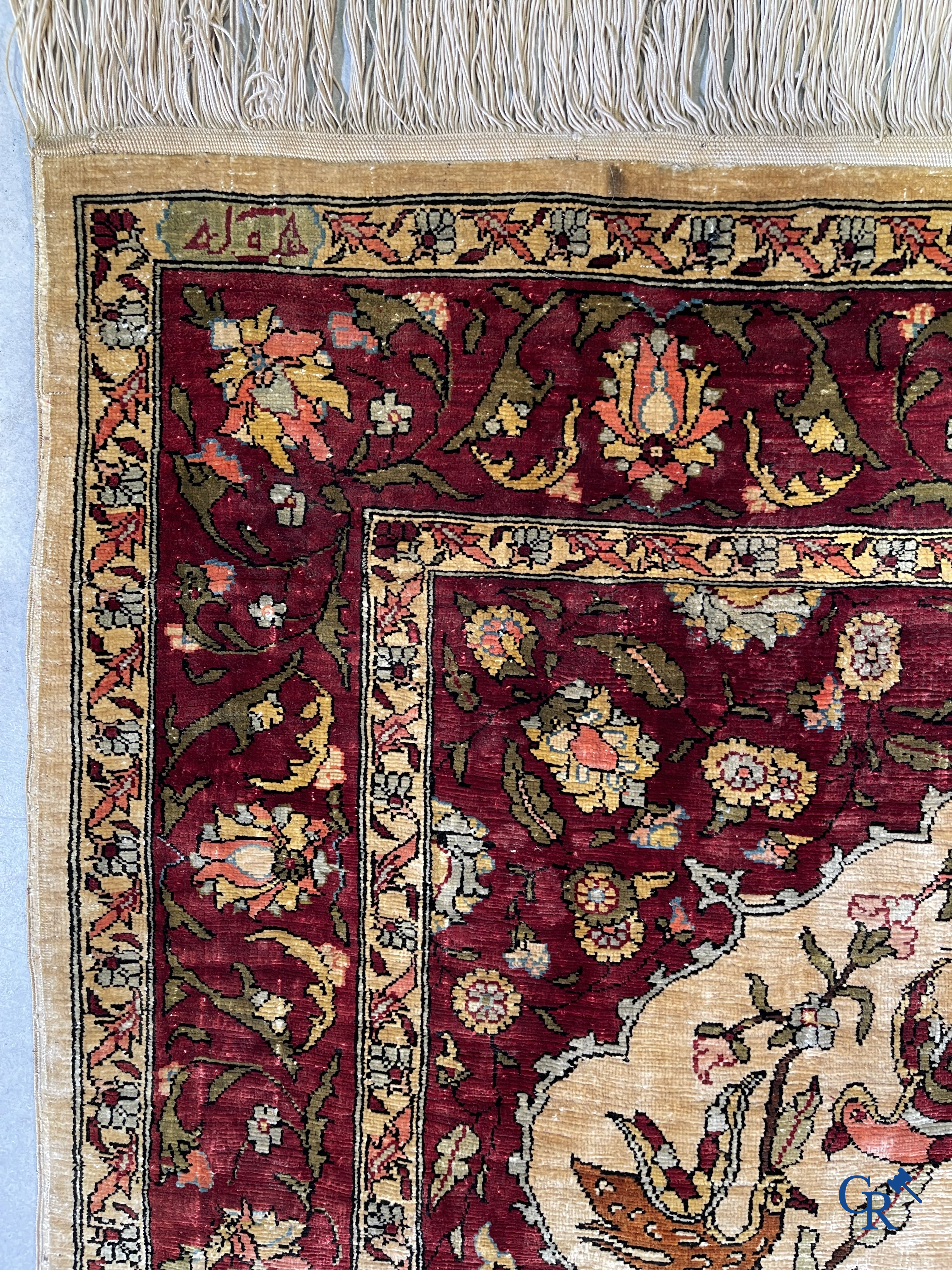 Oriental carpets, Hereke, a finely hand-knotted and signed silk carpet with a tree of life.