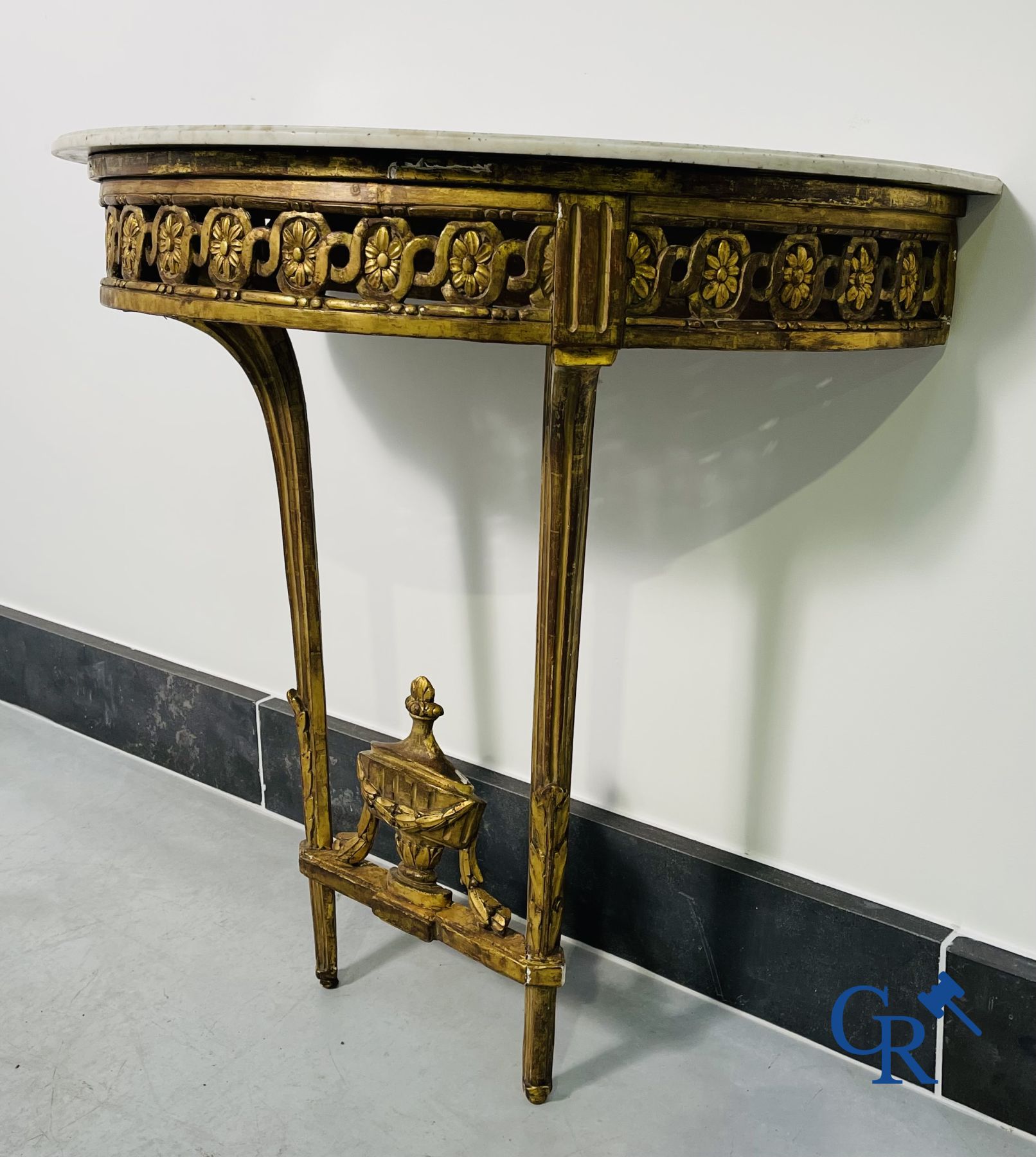 Furniture: Wood sculpted and gilded crescent shaped console. LXVI-period.