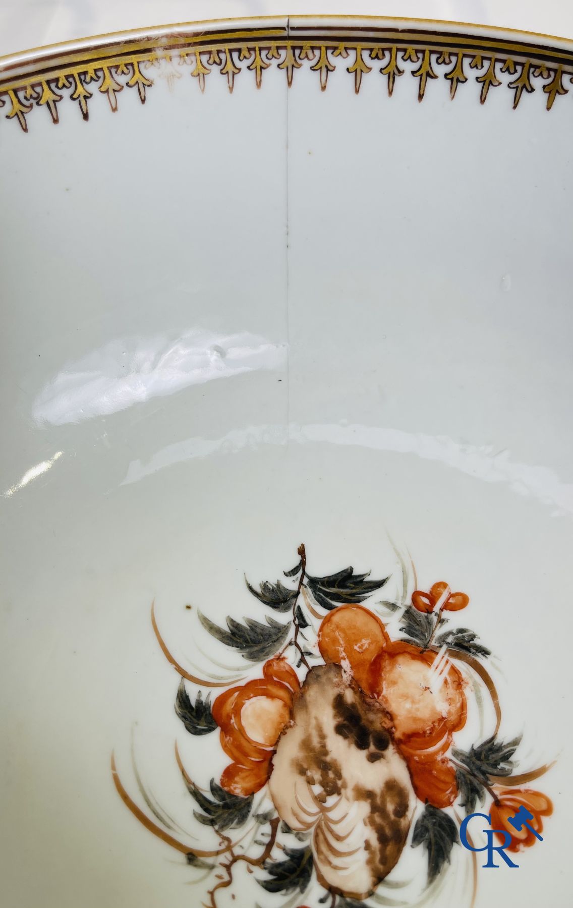 A large Chinese famille rose mandarin bowl, a famille rose cup and saucer and a figurine in blanc de chine.