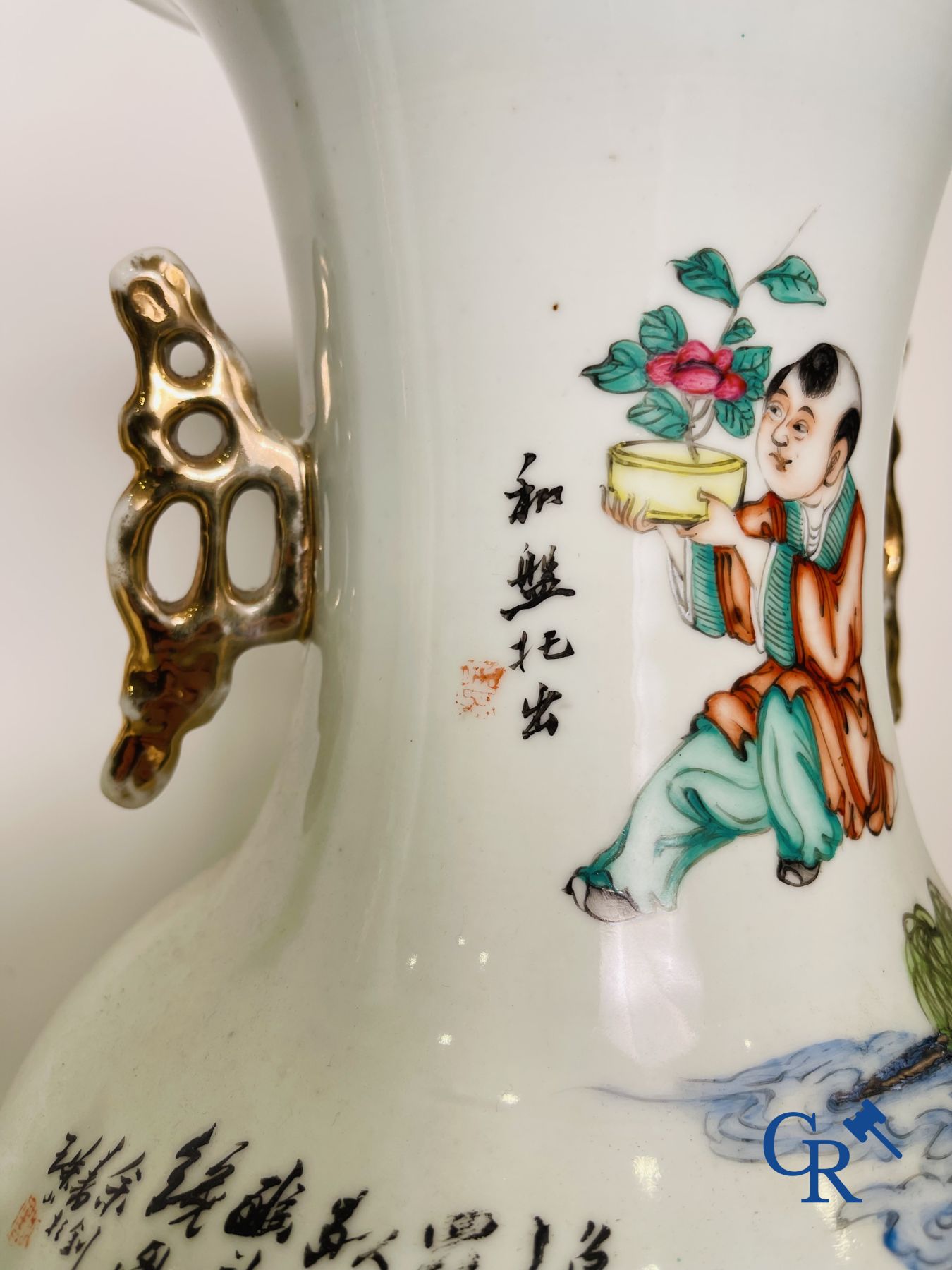 Chinese porcelain: A pair of Chinese vases with a double decor.