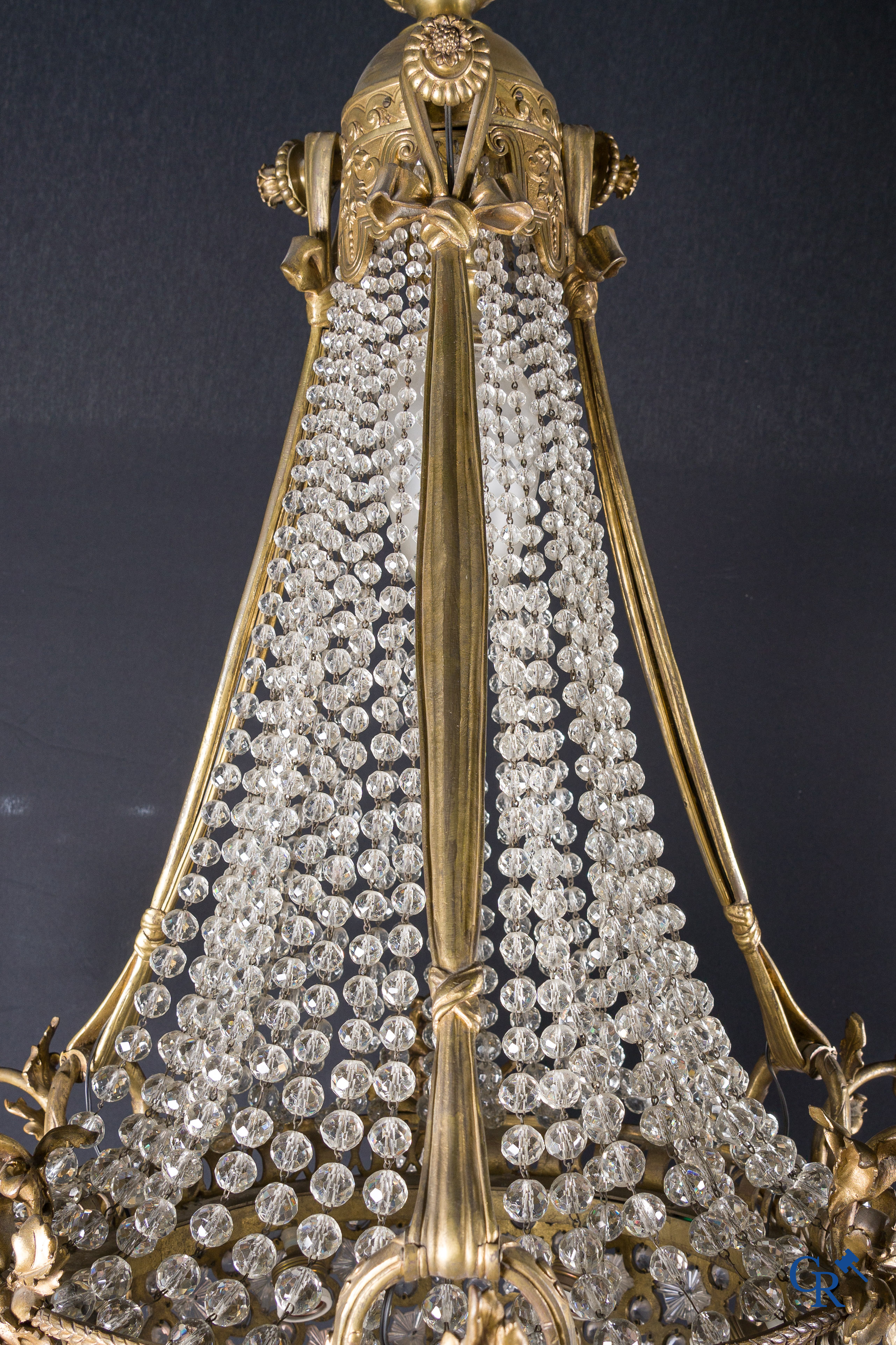 An imposing bronze and crystal chandelier in LXVI style. Circa 1920.