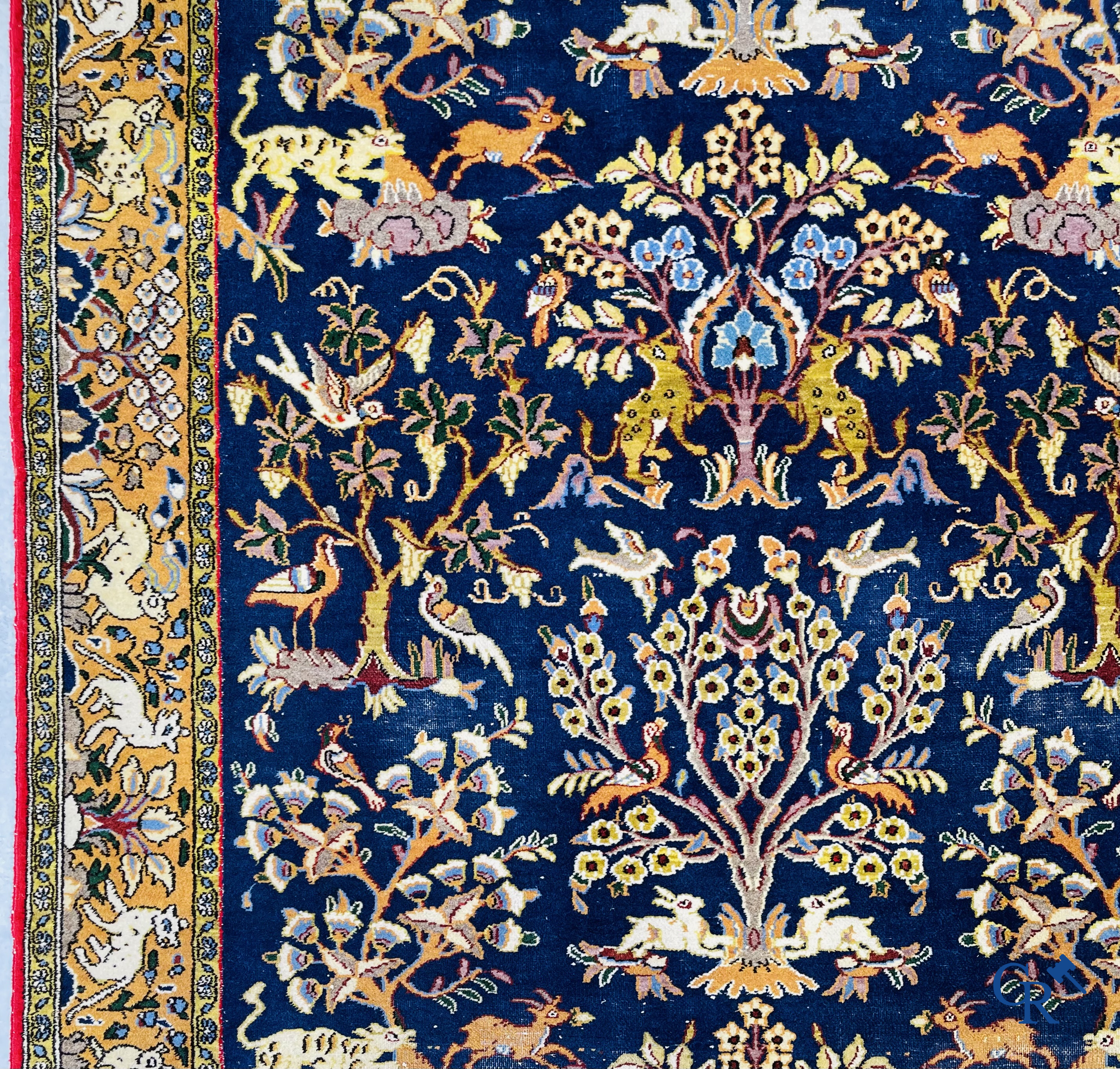 Oriental carpets: Iran, hand-knotted Persian carpet with decor of forest animals.