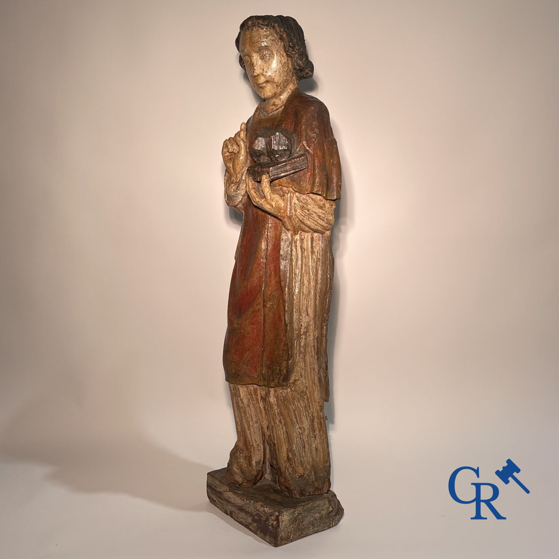 Wooden sculpture: Polychrome wood sculpture of a saint. Saint Stephen. Probably 17th century.